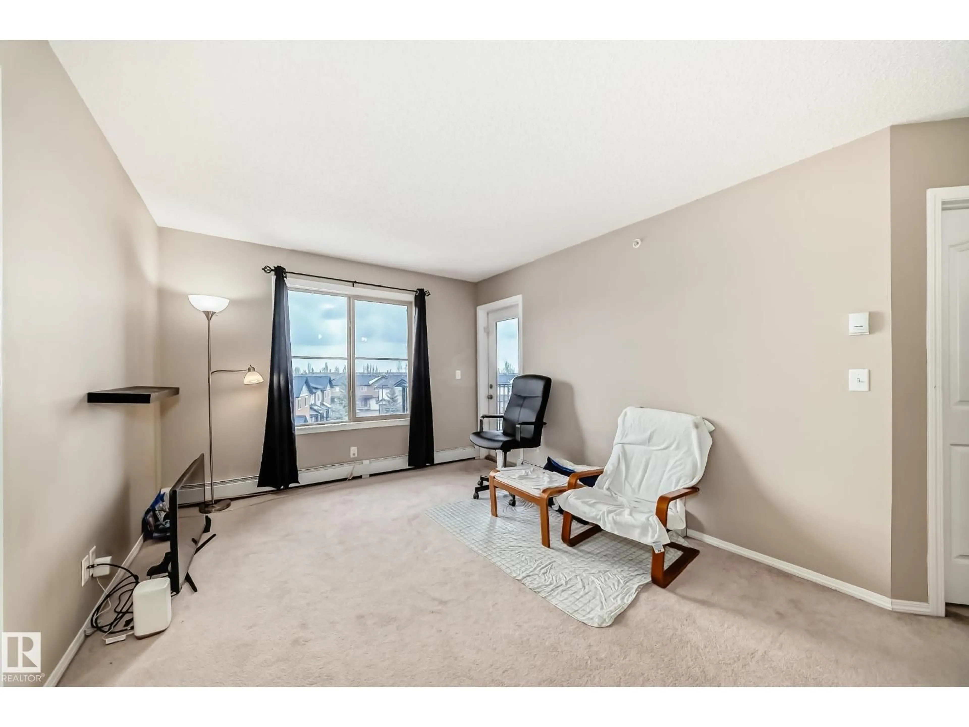 Living room with furniture, carpet floor for #404 - 12025 22 AV, Edmonton Alberta T6W2Y1