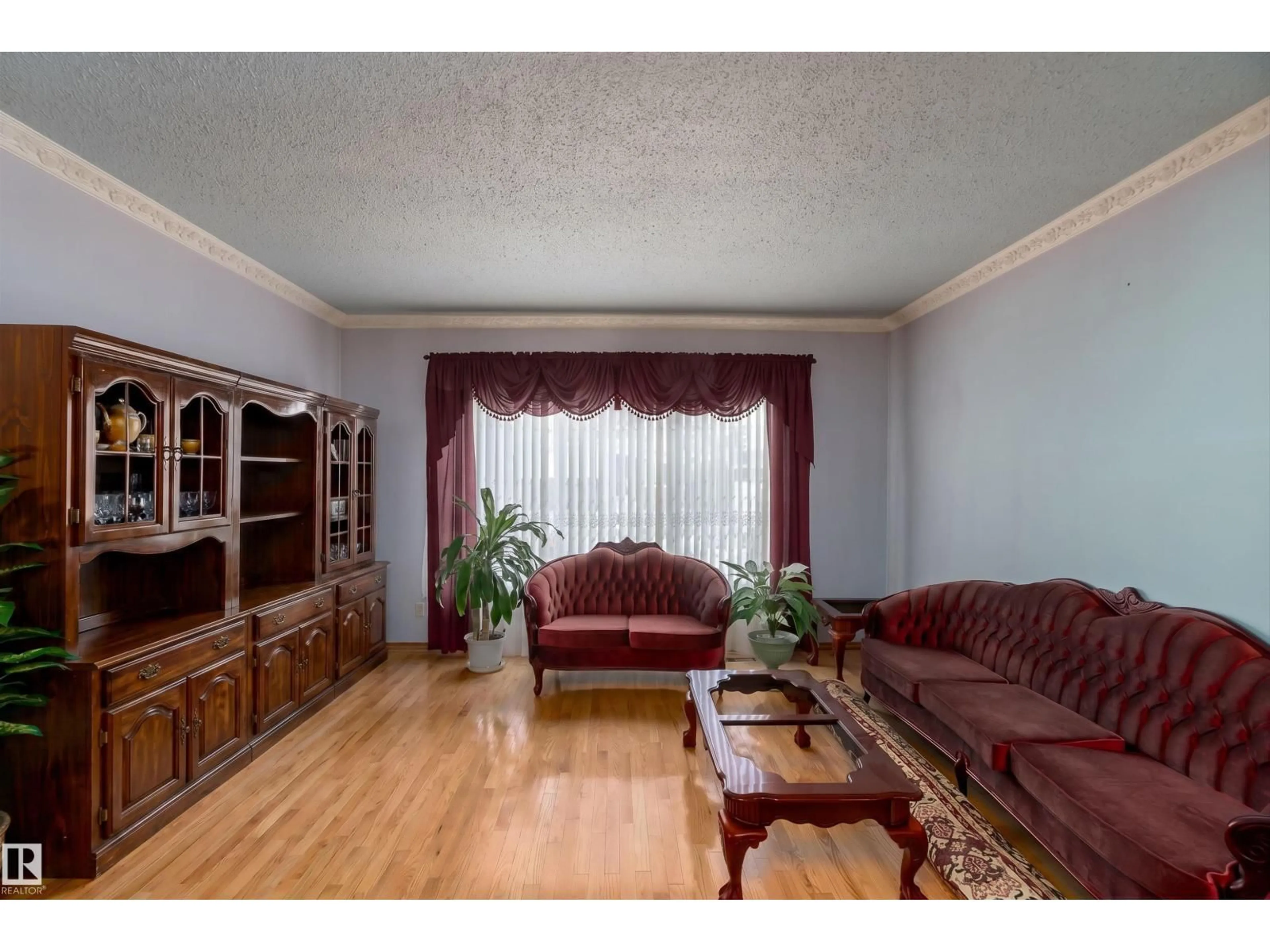 Living room with furniture, wood/laminate floor for 15907 101 ST, Edmonton Alberta T5X4E6