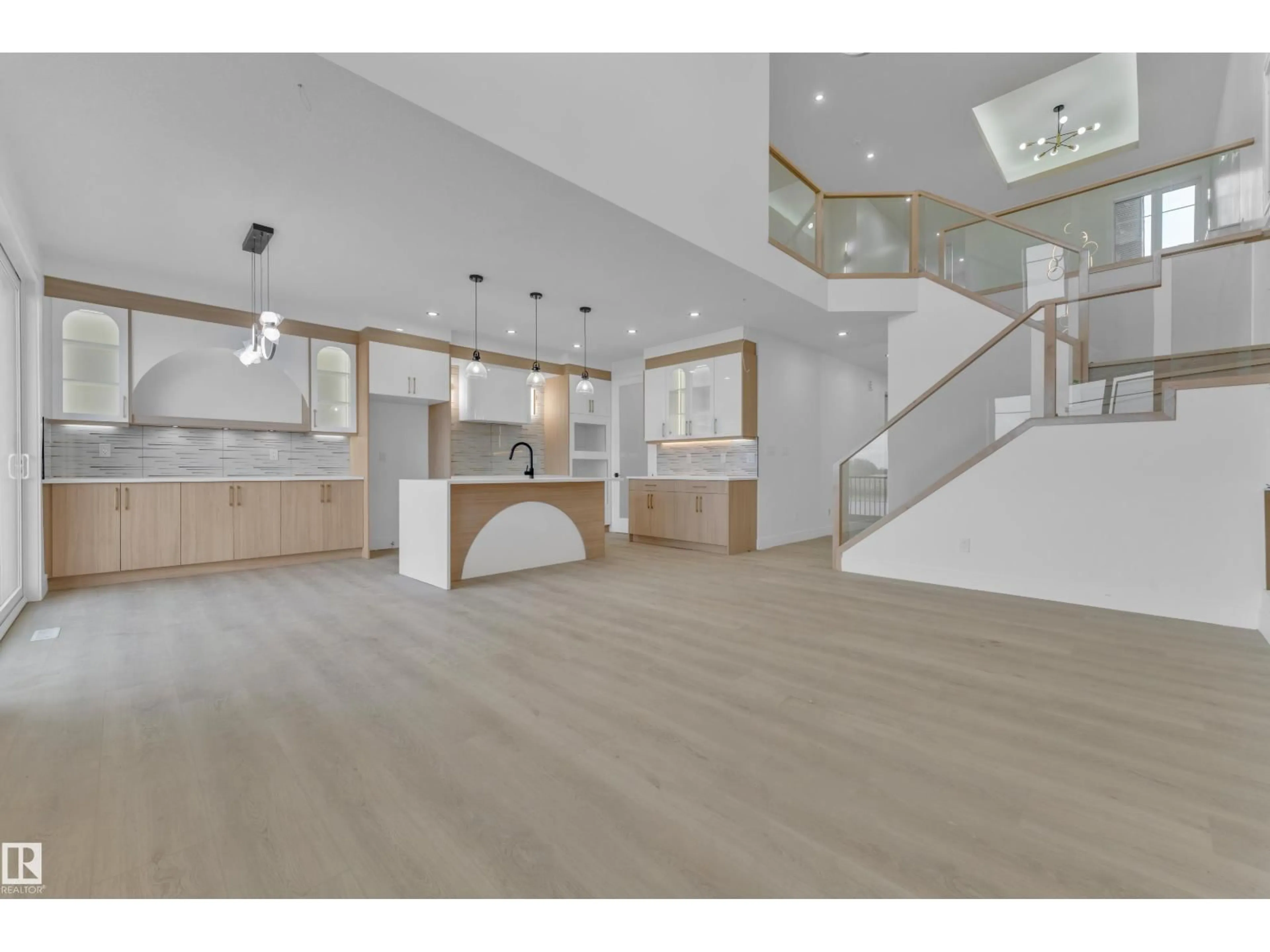 Open concept kitchen, wood/laminate floor for 449 CRYSTAL CREEK LINK, Leduc Alberta T9E0X5