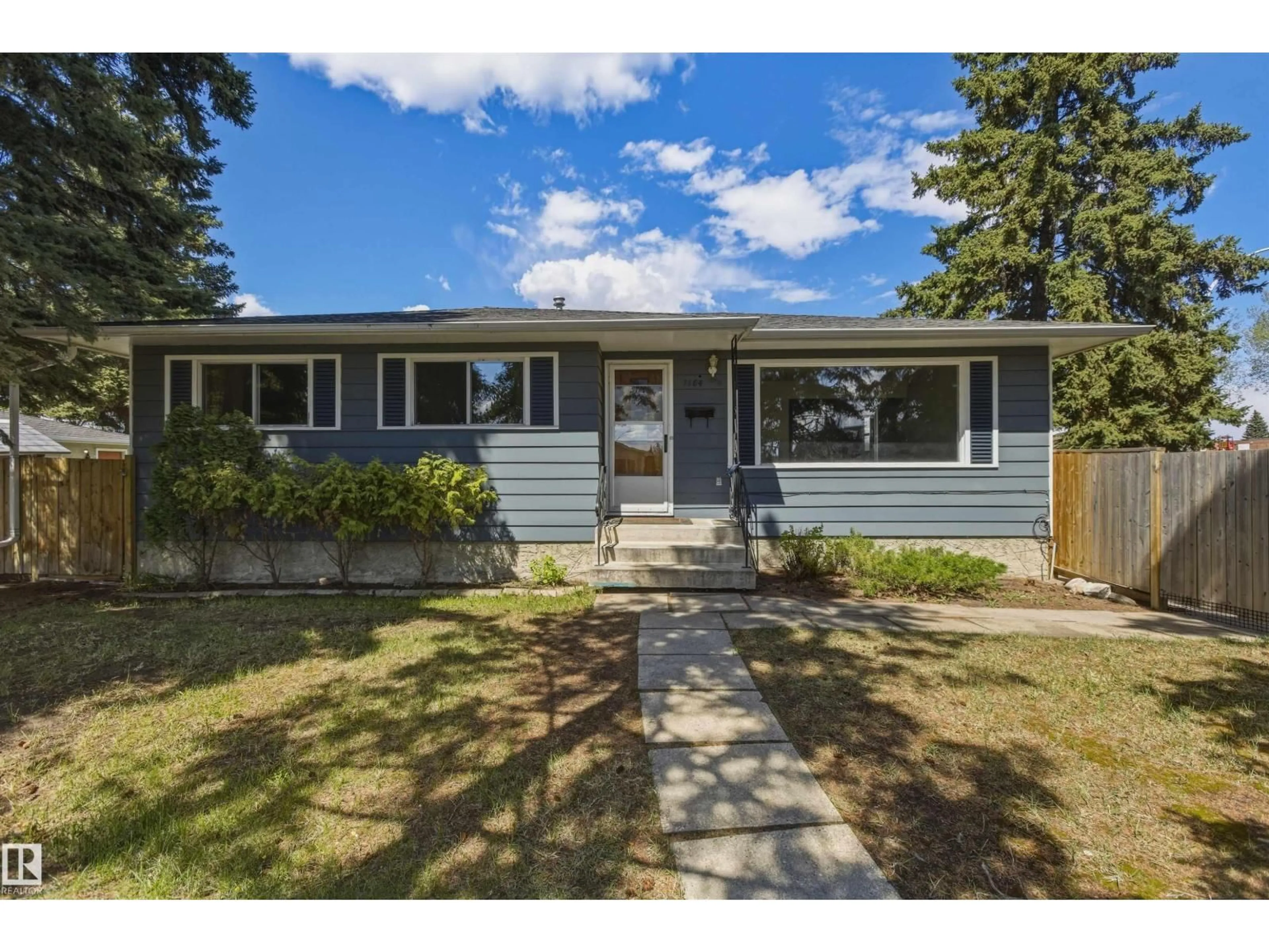 Home with vinyl exterior material, street for NW - 7604 142 AV, Edmonton Alberta T5C2P4
