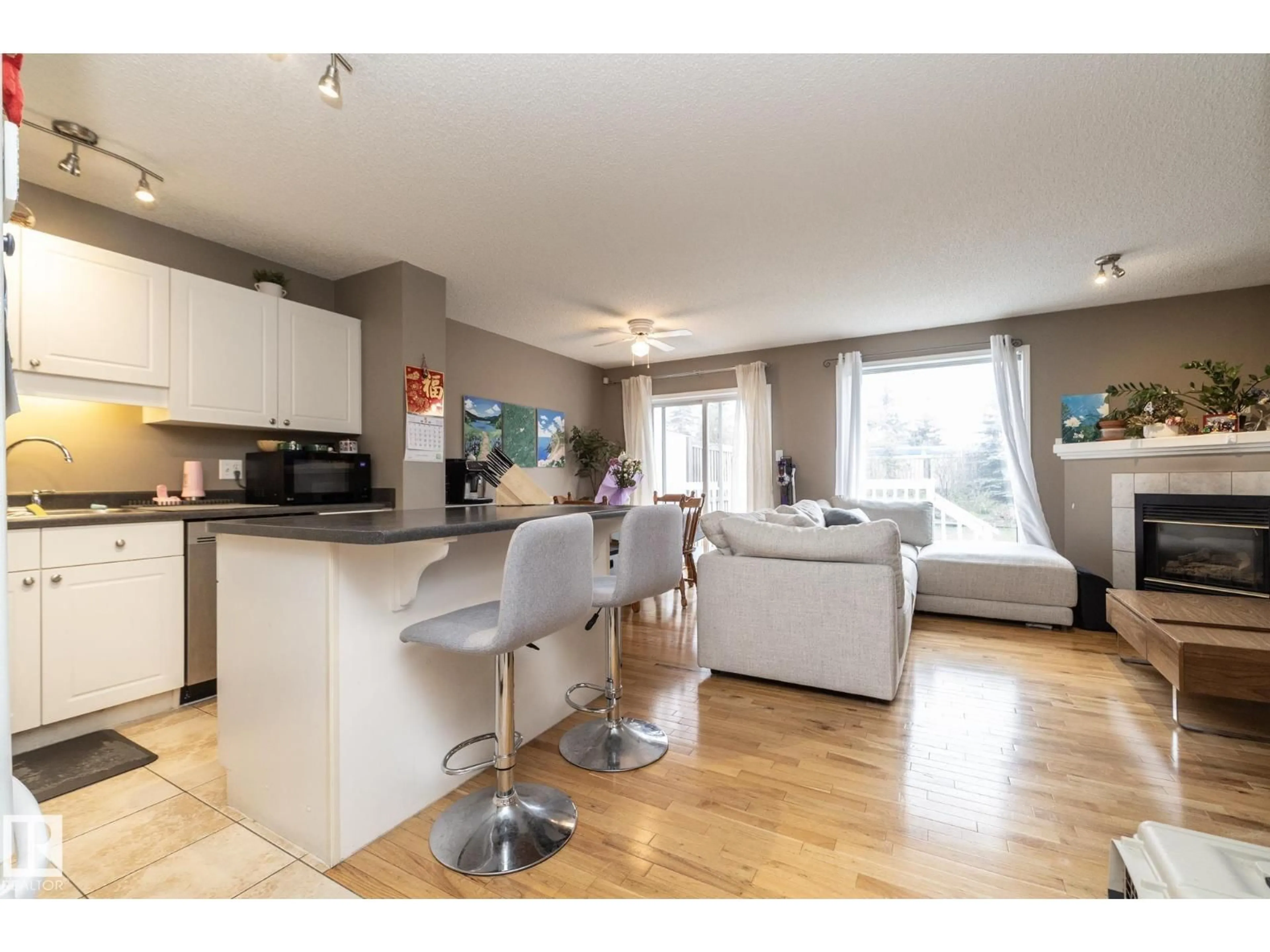 Open concept kitchen, wood/laminate floor for NW - 9112 166 AV, Edmonton Alberta T5Z3H5