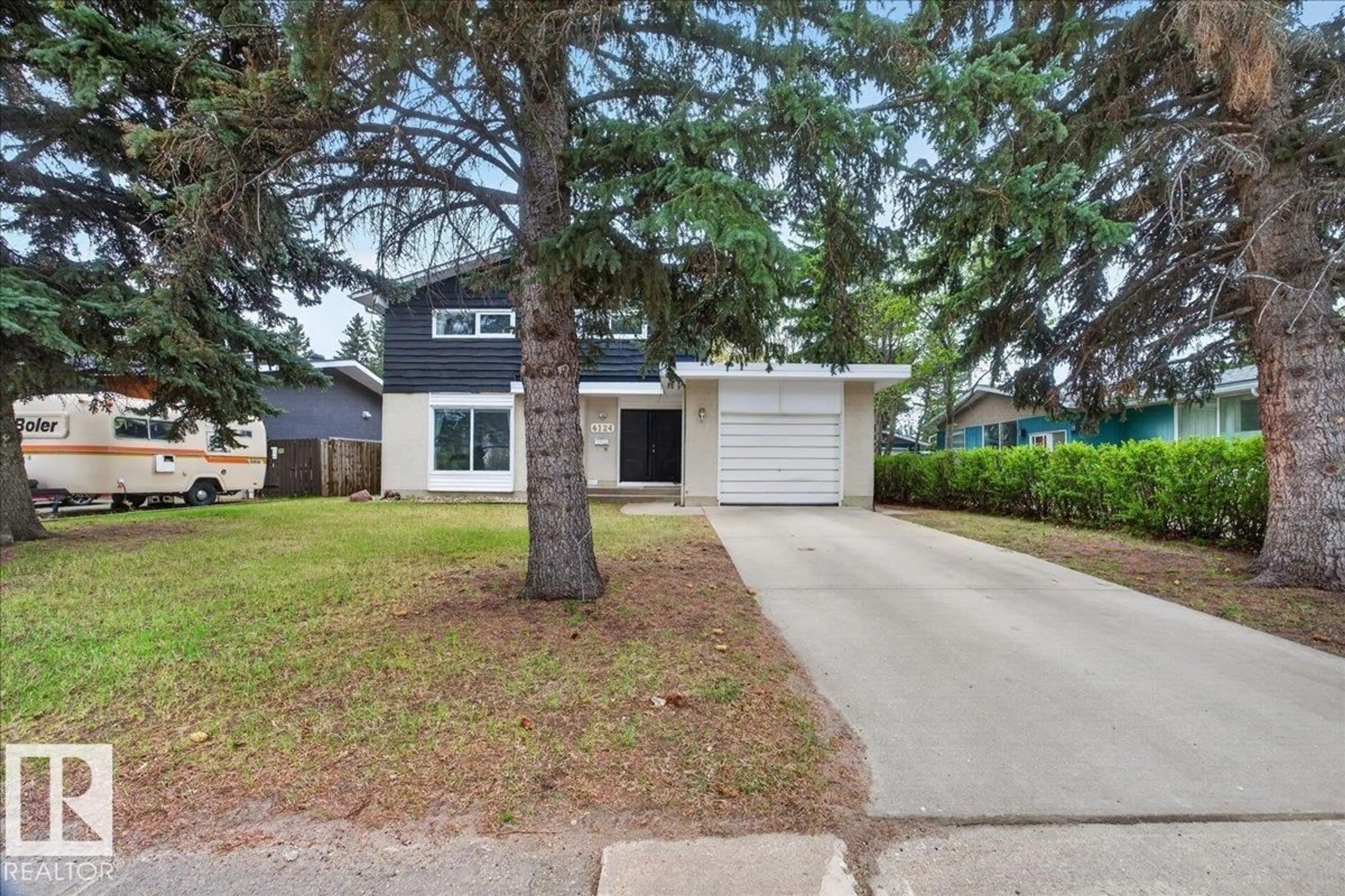 Home with vinyl exterior material, street for NW - 4124 121 ST, Edmonton Alberta T6J1Y5