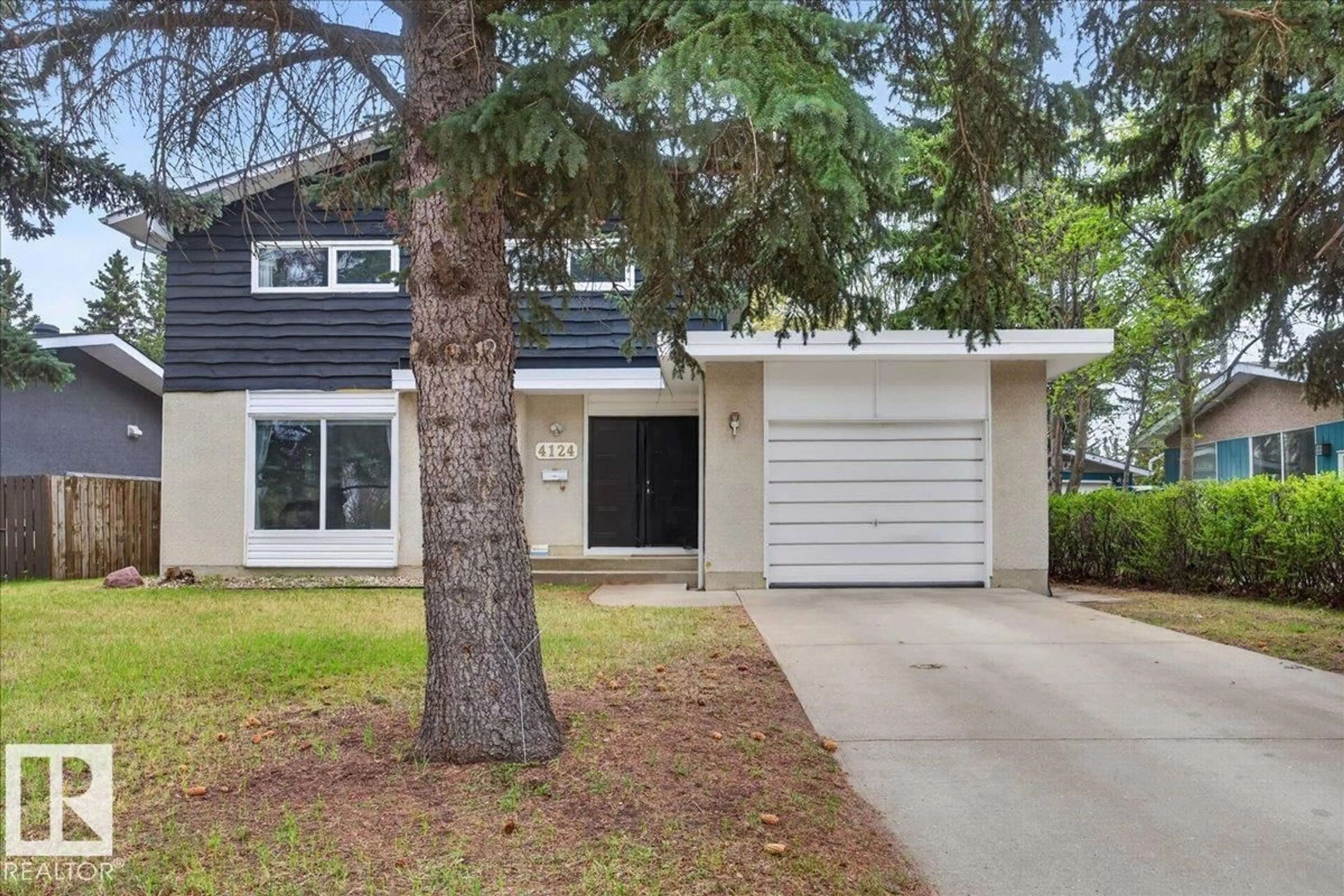 Home with vinyl exterior material, street for NW - 4124 121 ST, Edmonton Alberta T6J1Y5