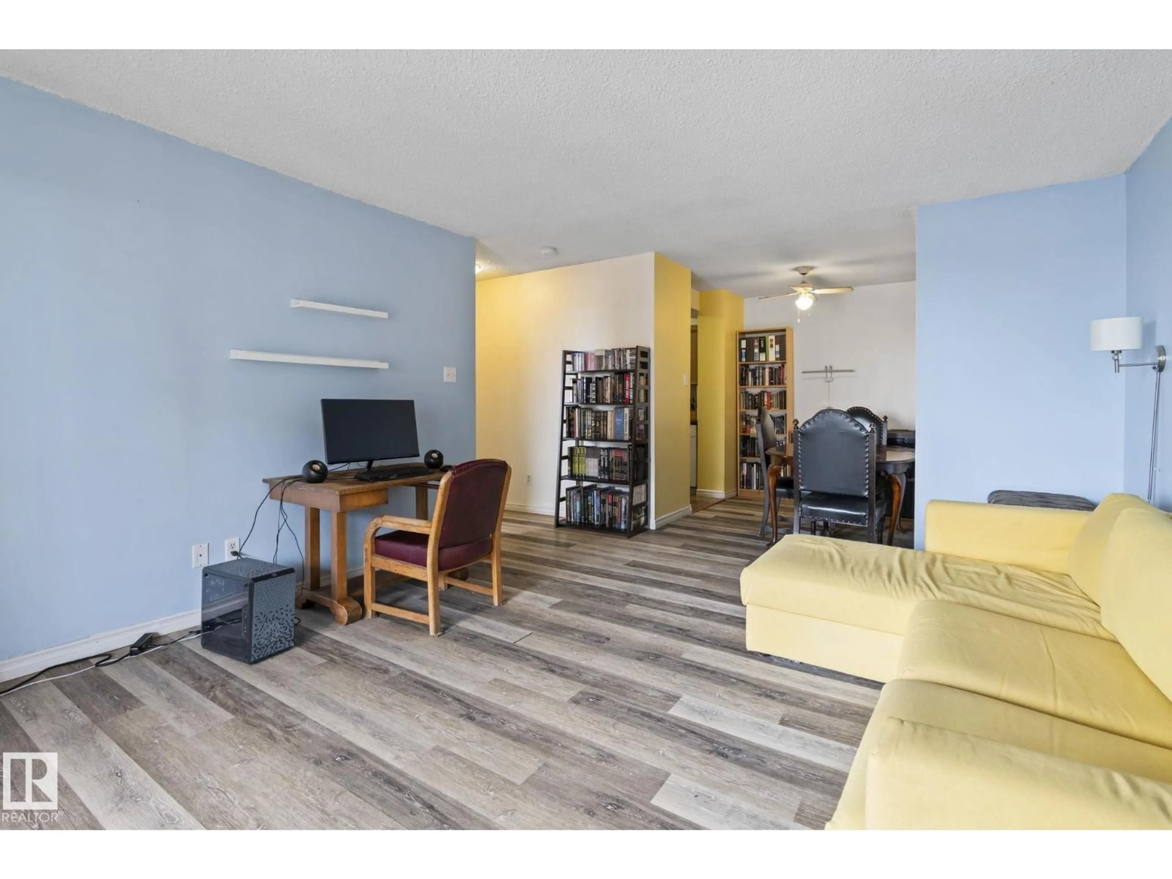 Living room with furniture, wood/laminate floor for NW - 712 12841 65 ST, Edmonton Alberta T5A4N4