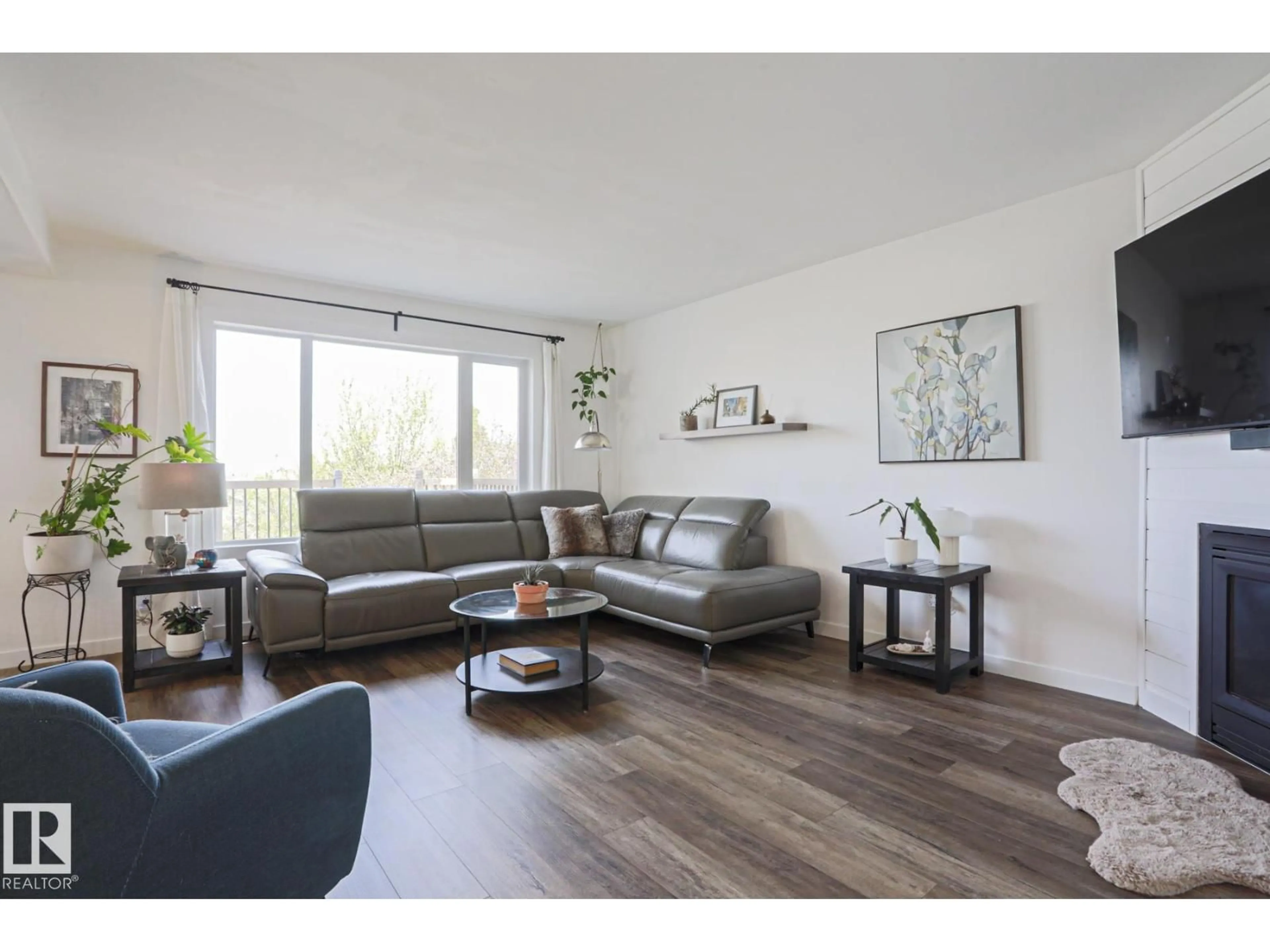 Living room with furniture, wood/laminate floor for 284 LILAC TR, Sherwood Park Alberta T8H1Z2