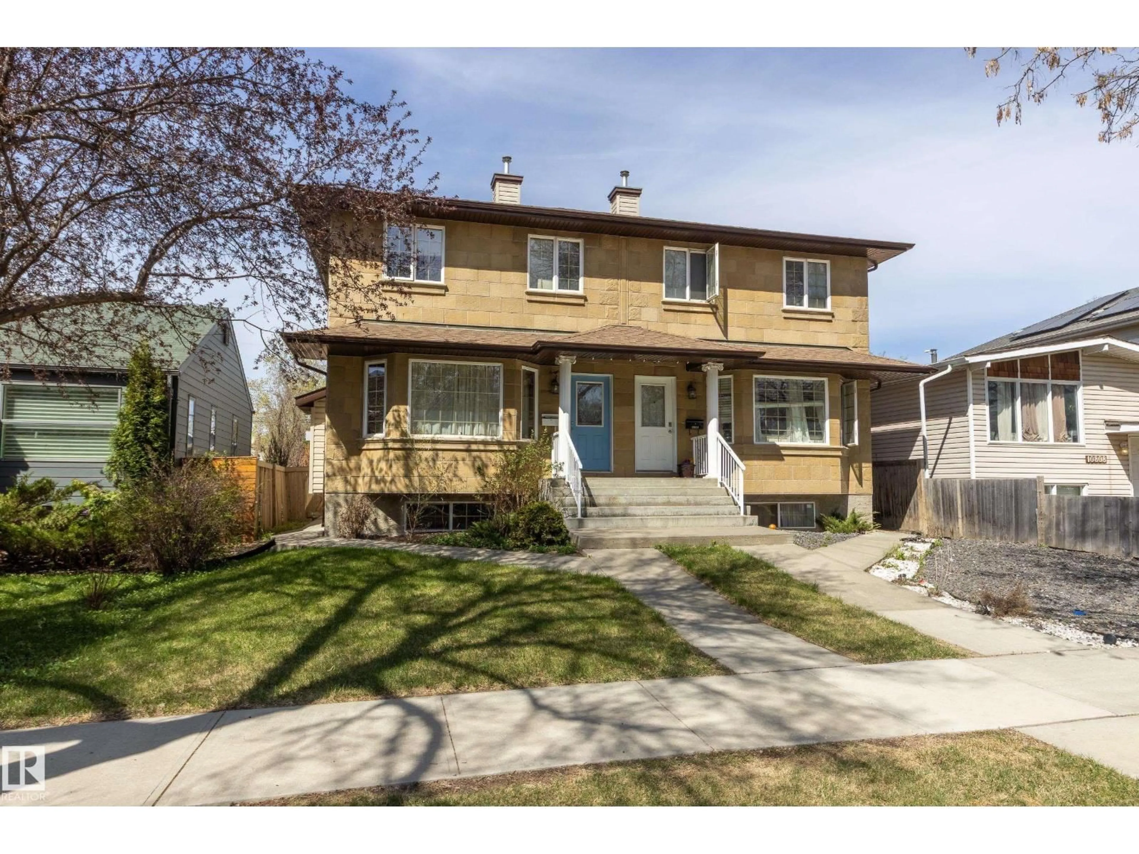 Home with vinyl exterior material, street for 10816 67 AV, Edmonton Alberta T6H2A3