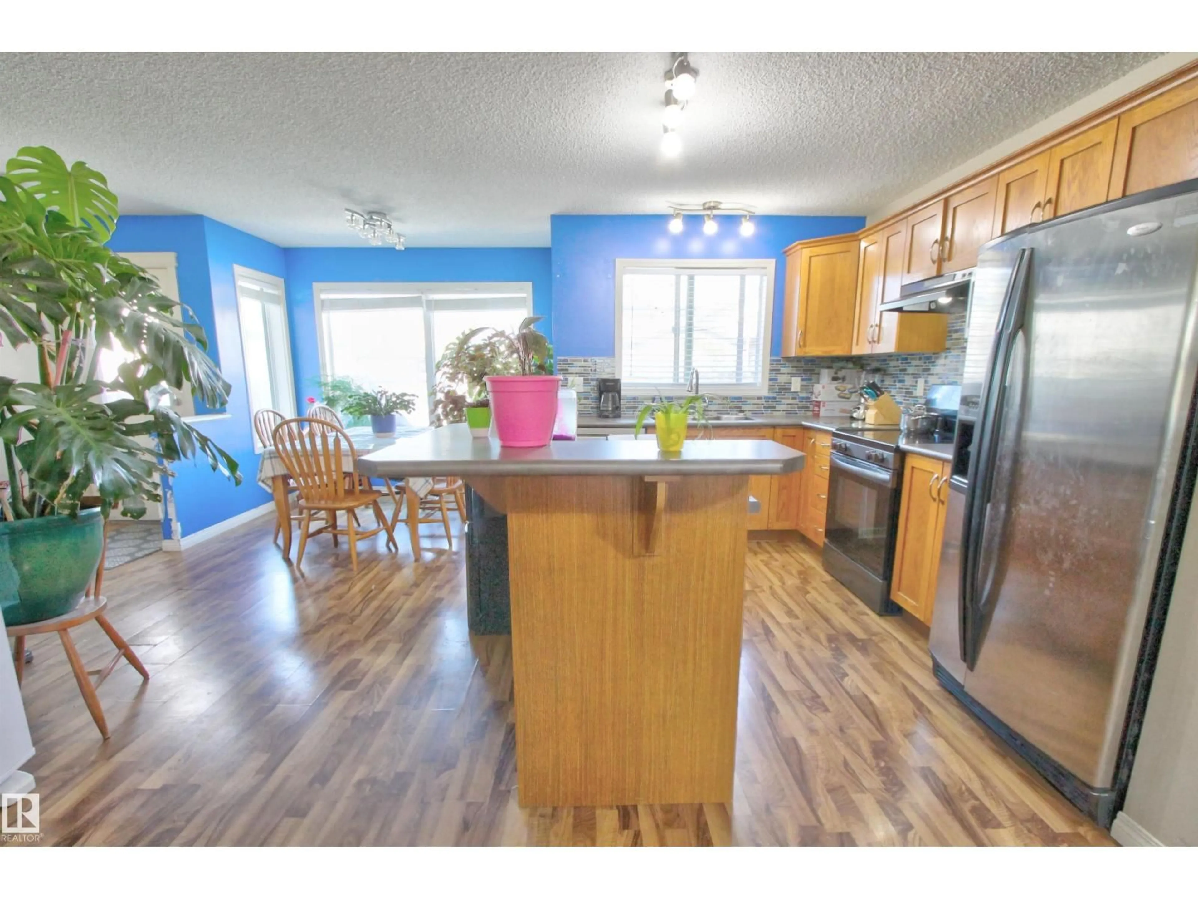 Open concept kitchen, wood/laminate floor for 14820 140 ST, Edmonton Alberta T6V0A4