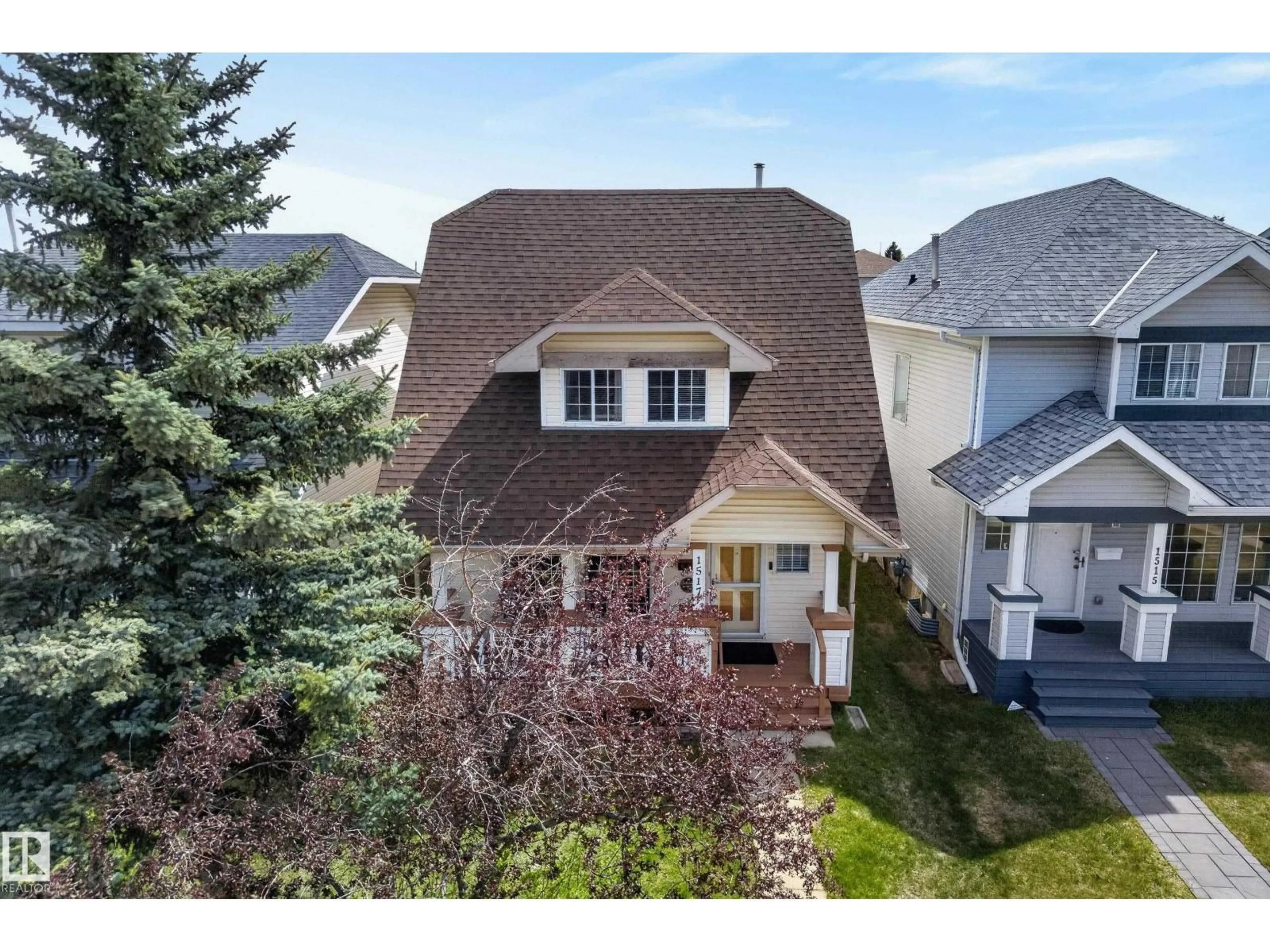 Home with vinyl exterior material, street for 1517 JARVIS CR, Edmonton Alberta T6L6S4