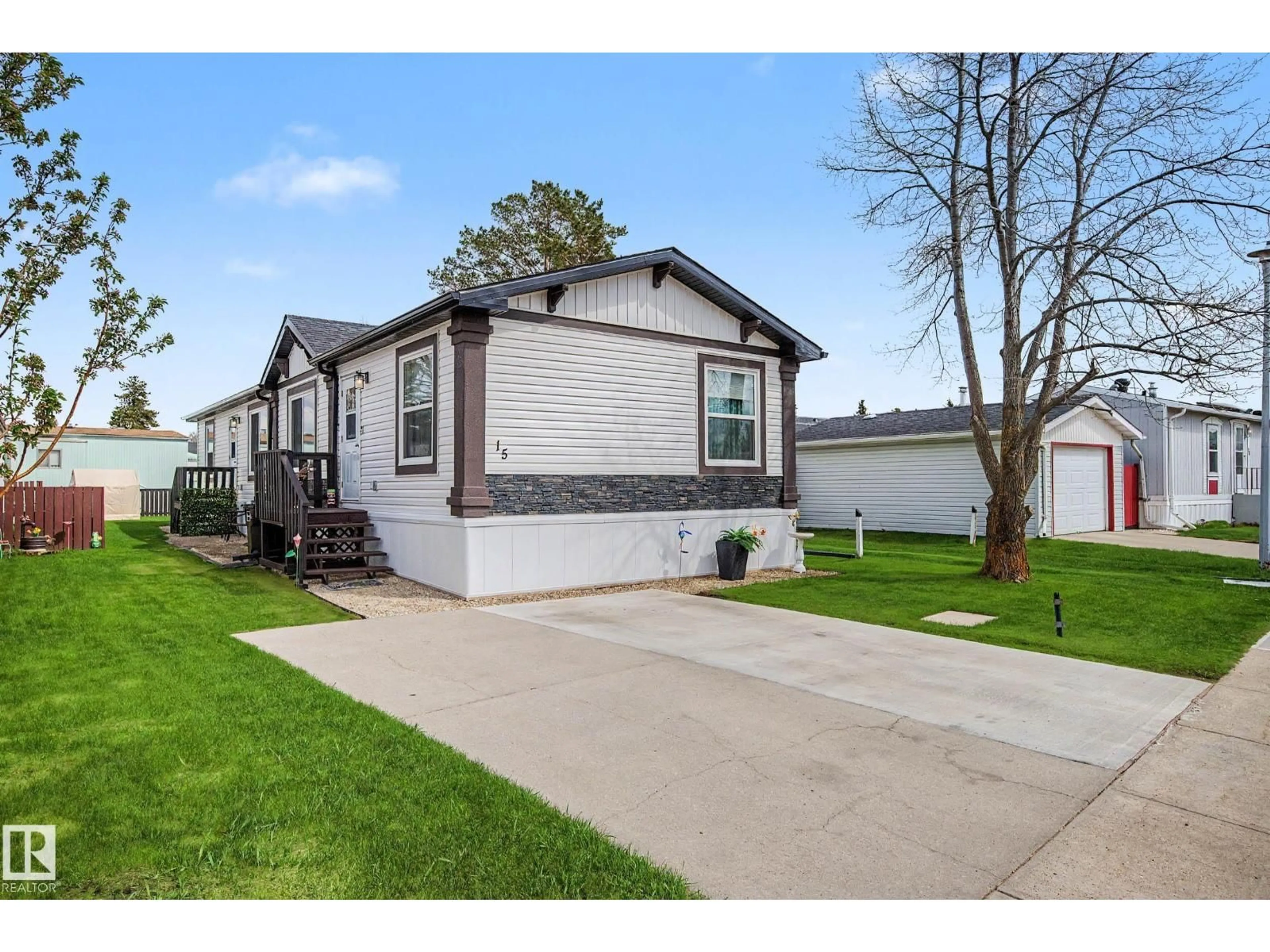 Home with vinyl exterior material, street for #15 - 12604 153 AV, Edmonton Alberta T5X4M7