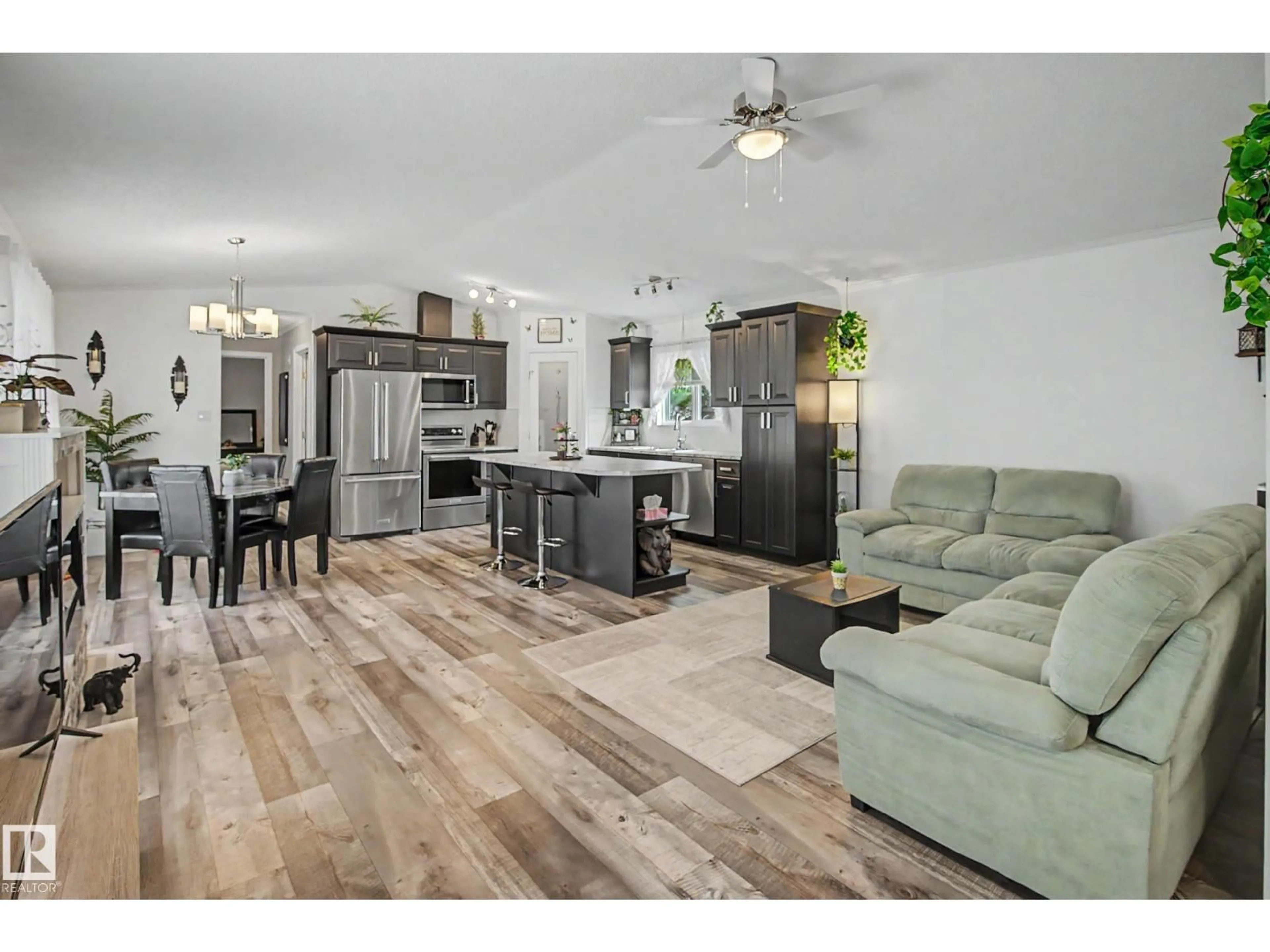 Open concept kitchen, wood/laminate floor for #15 - 12604 153 AV, Edmonton Alberta T5X4M7