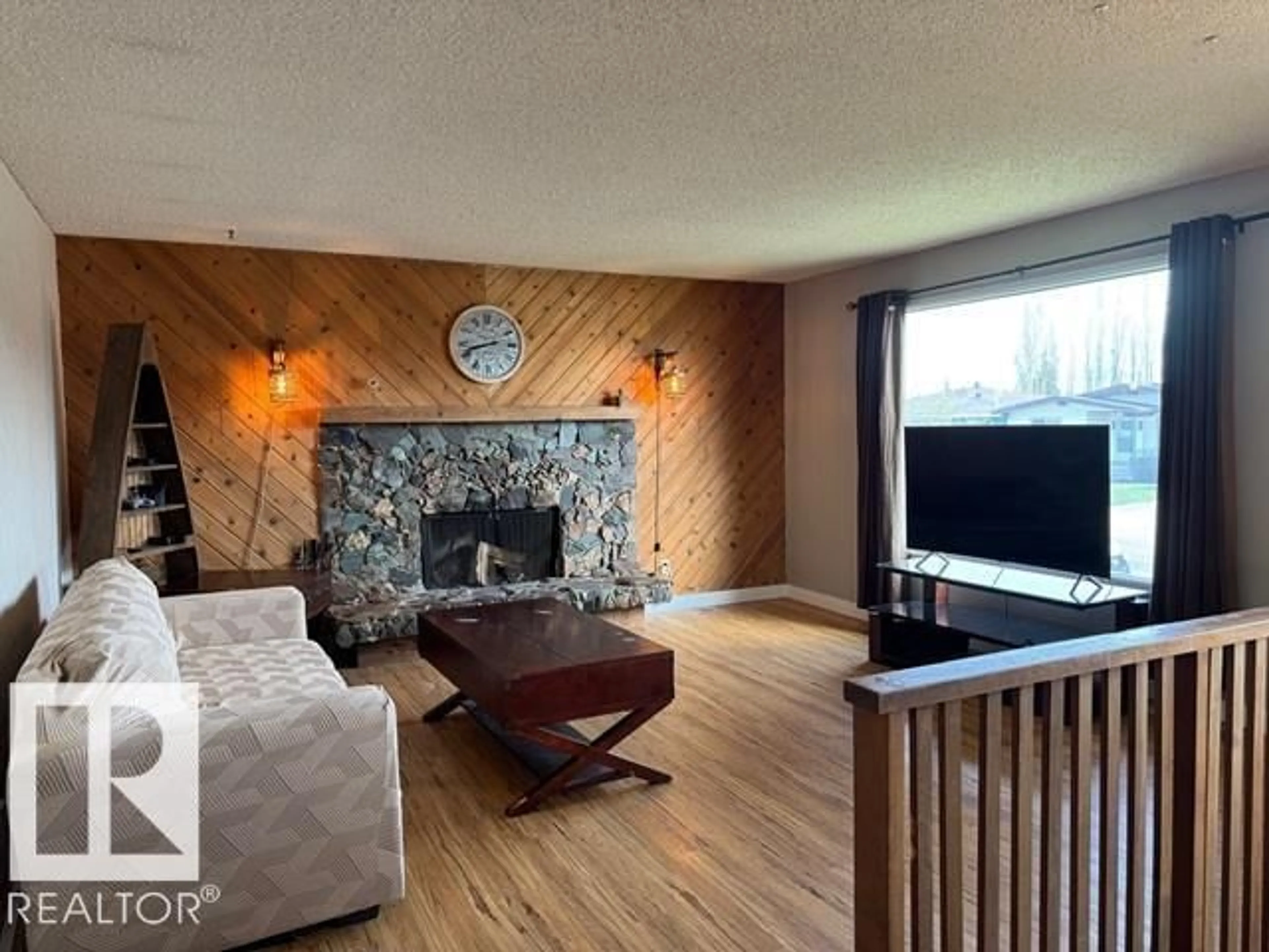 Living room with furniture, wood/laminate floor for 8804 29 AV, Edmonton Alberta T6K2X6