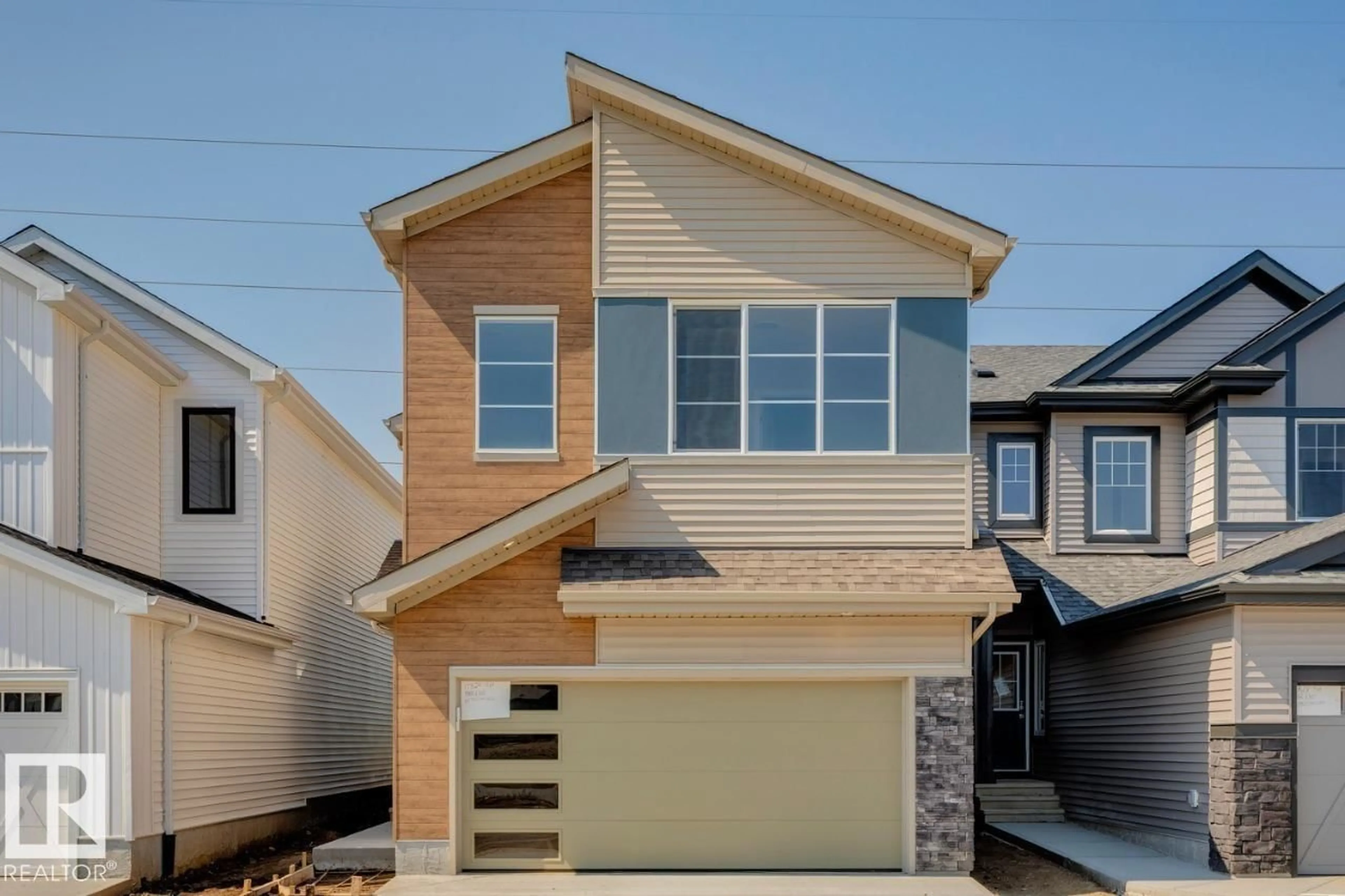 Home with vinyl exterior material, street for 17324 5TH ST, Edmonton Alberta T5Y4K7