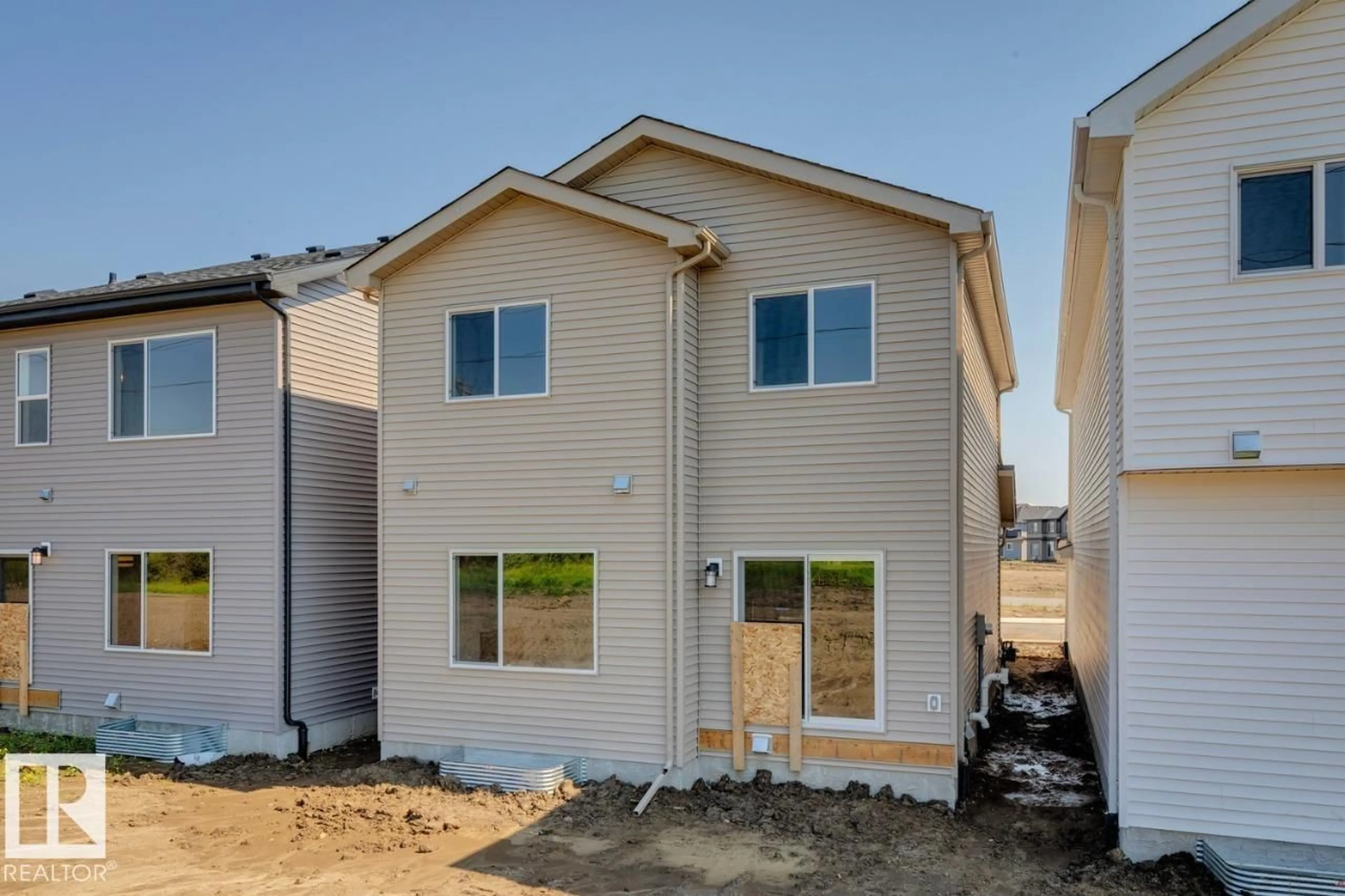 Home with vinyl exterior material, street for 17324 5TH ST, Edmonton Alberta T5Y4K7
