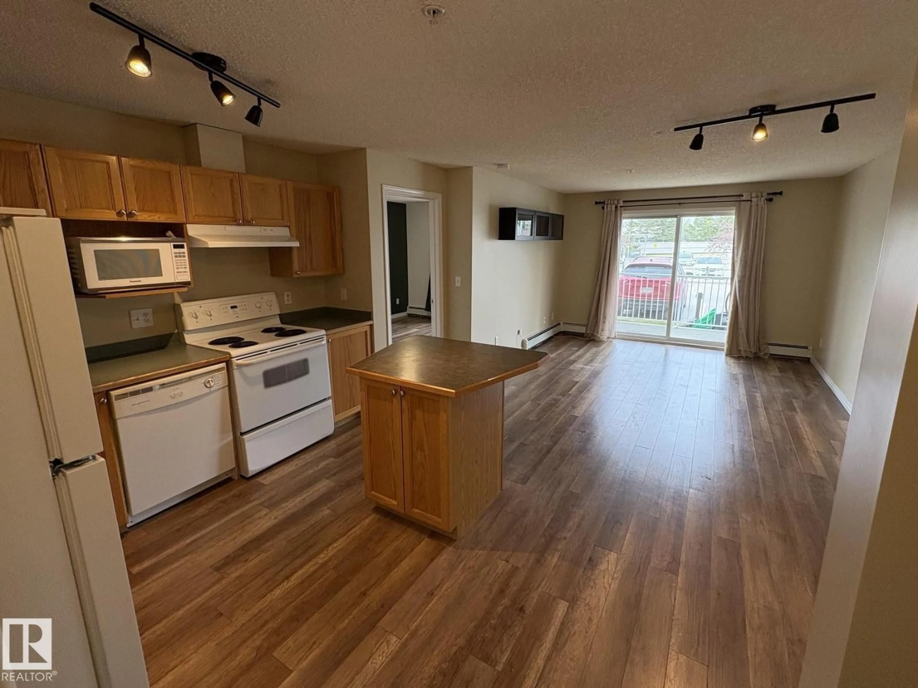 Open concept kitchen, wood/laminate floor for 138 9525 162 AV NW, Edmonton Alberta T5Z3V2