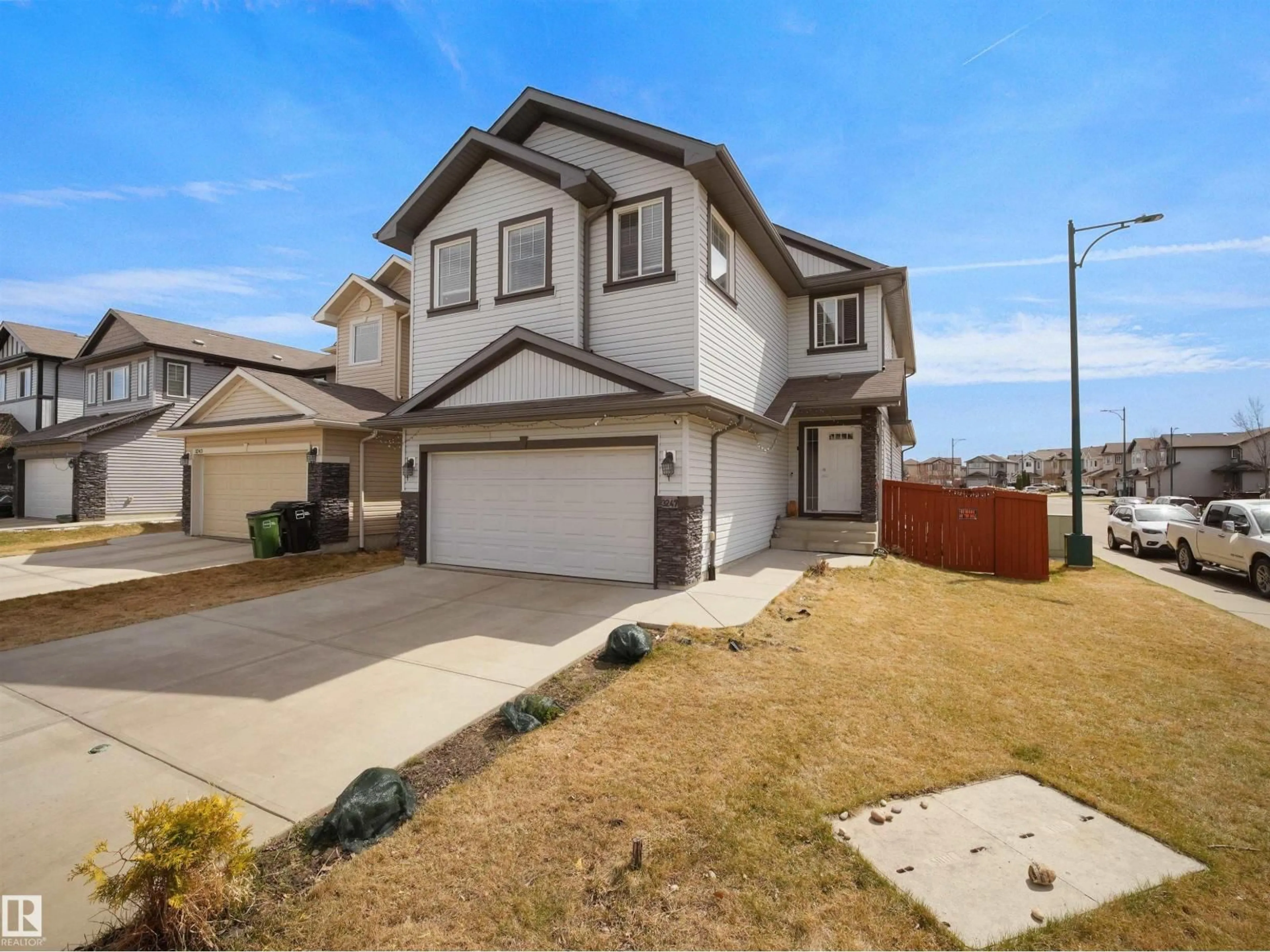 Home with vinyl exterior material, street for NW - 3247 15 AV, Edmonton Alberta T6T0V1