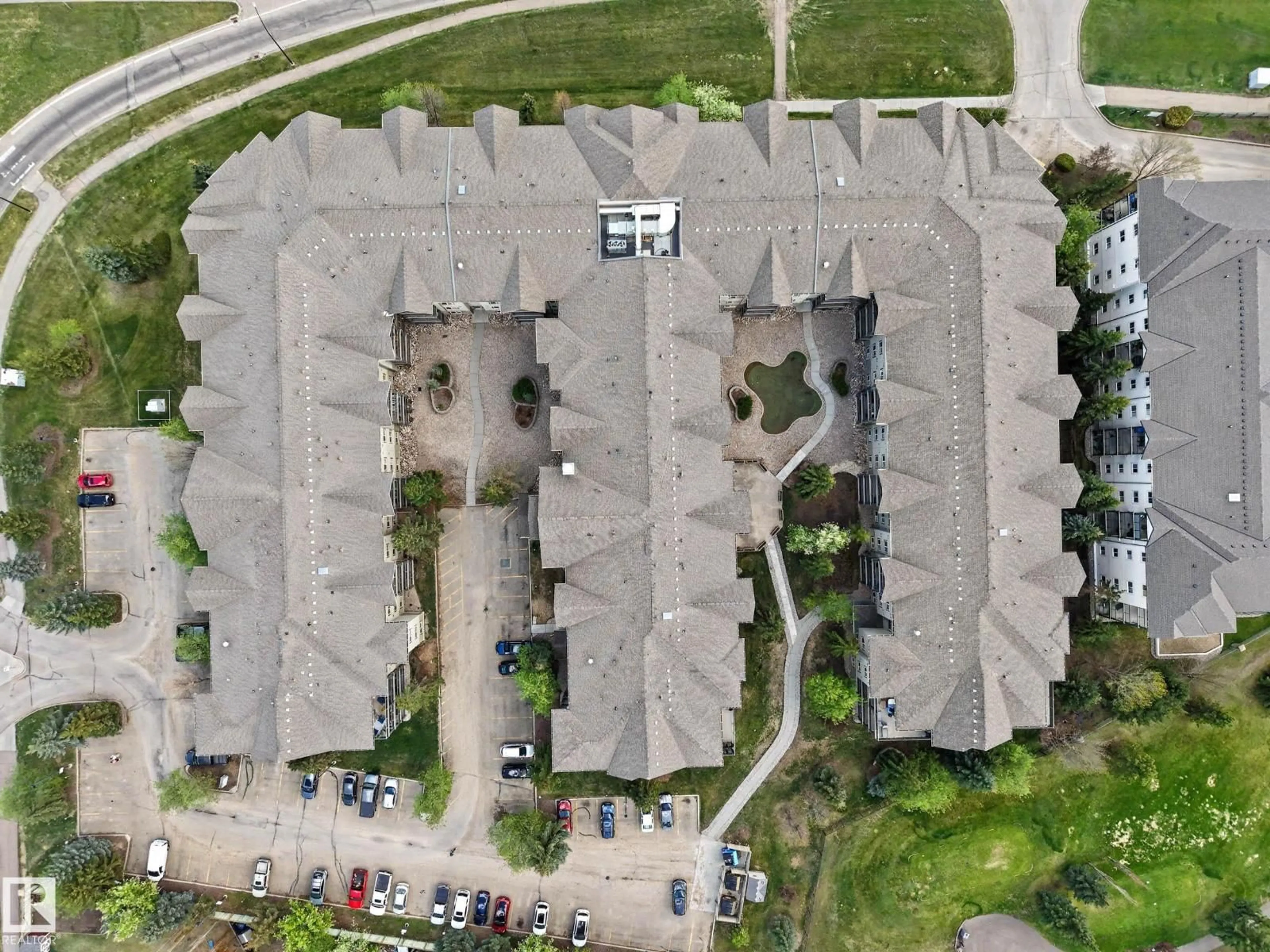 A pic from outside/outdoor area/front of a property/back of a property/a pic from drone, street for #221 - 279 SUDER GREENS DR, Edmonton Alberta T5T6X6