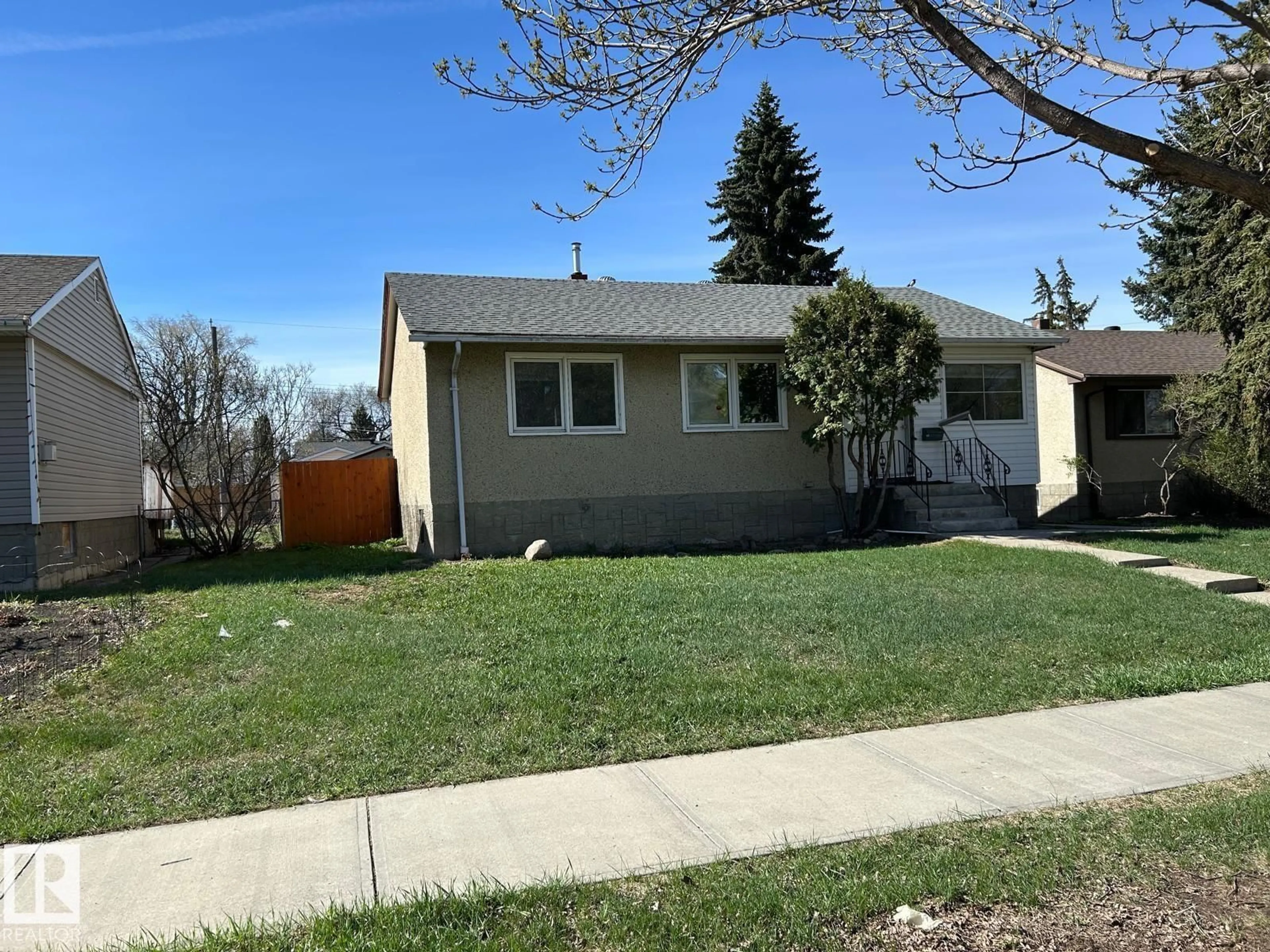 Home with vinyl exterior material, street for 13543 124A AV, Edmonton Alberta T5L3B4