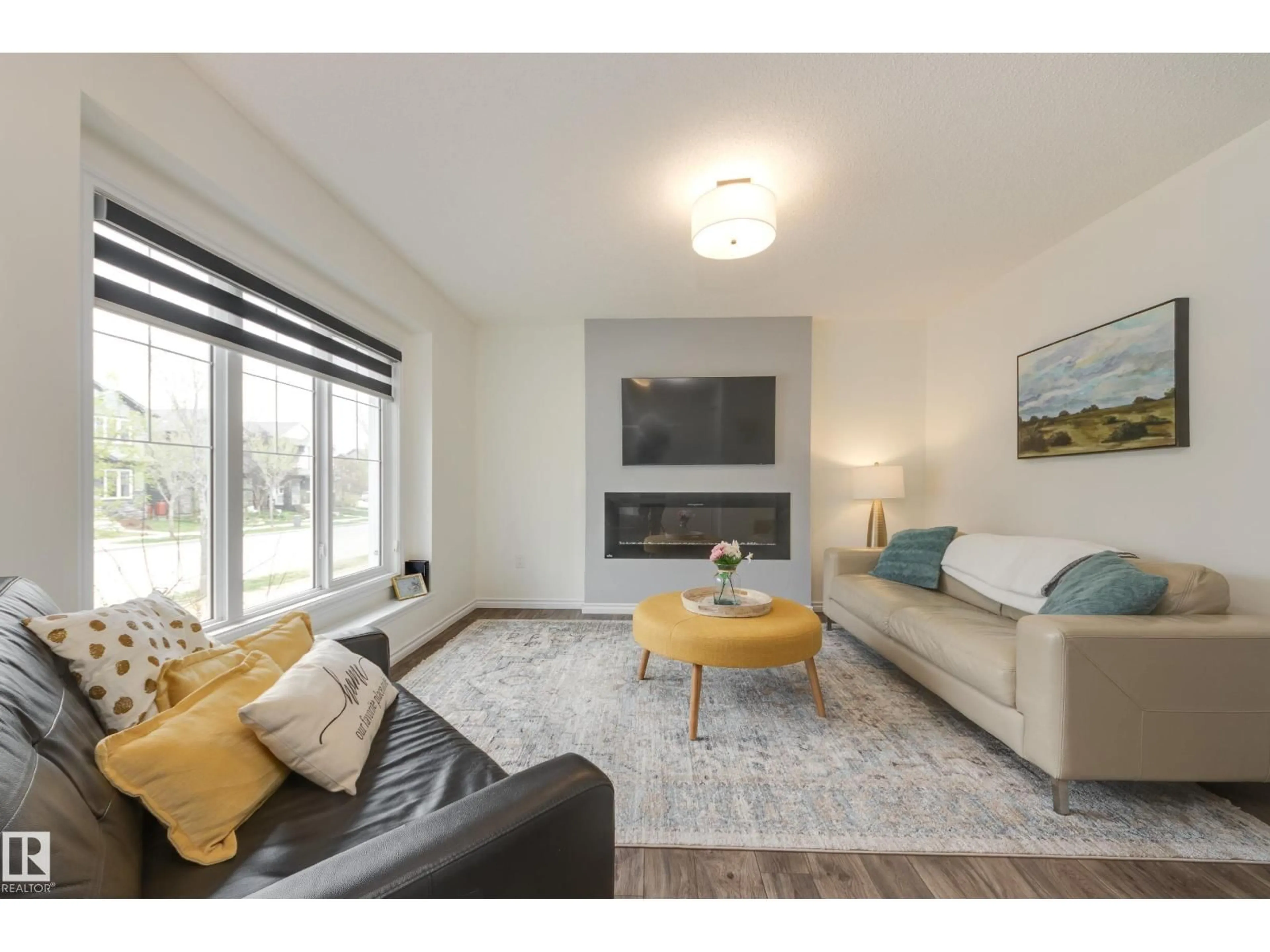 Living room with furniture, wood/laminate floor for NW - 22123 88 AV, Edmonton Alberta T5T7H3