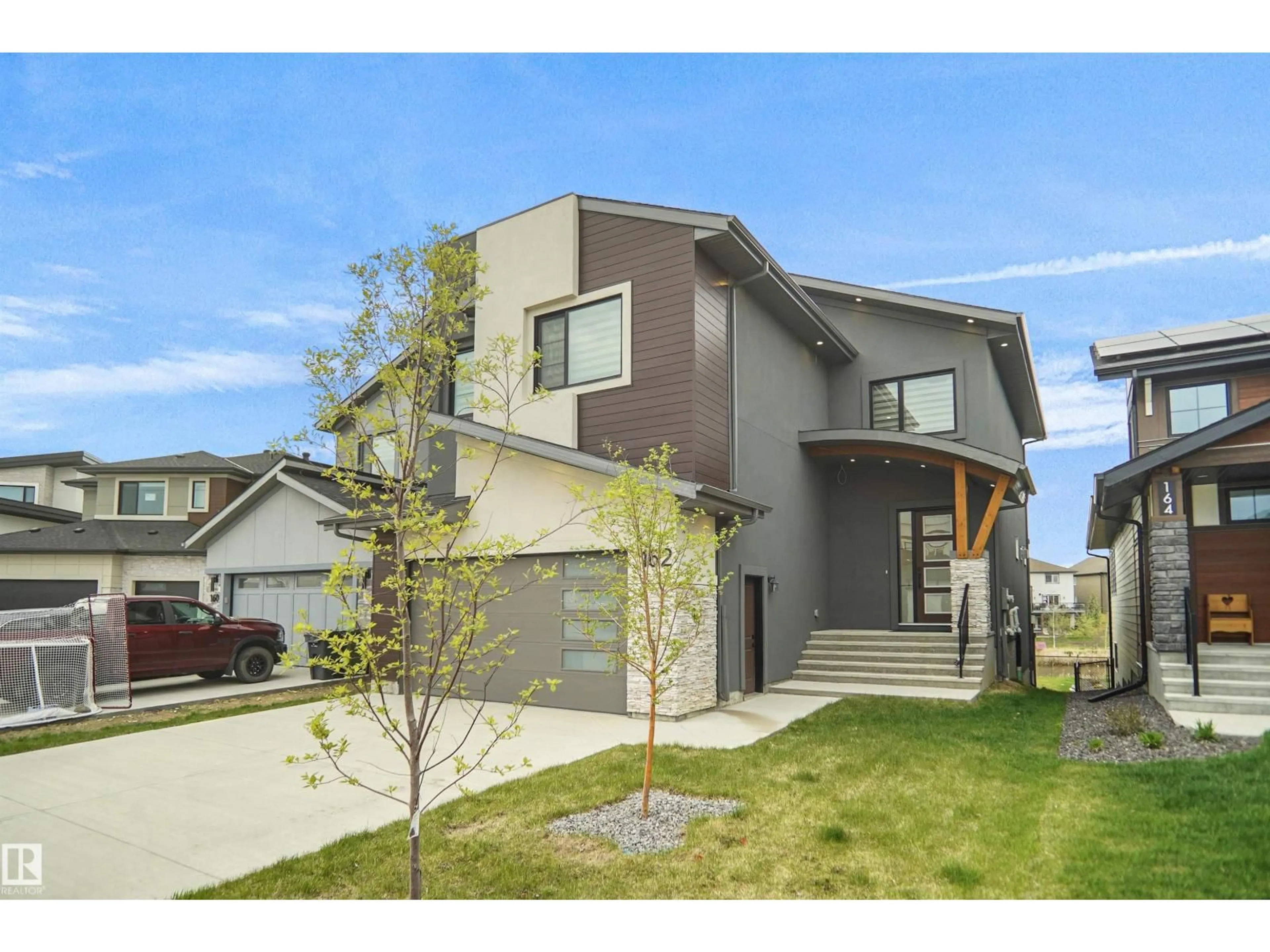 Home with vinyl exterior material, street for 162 EDGEWATER CI, Leduc Alberta T9E1K5
