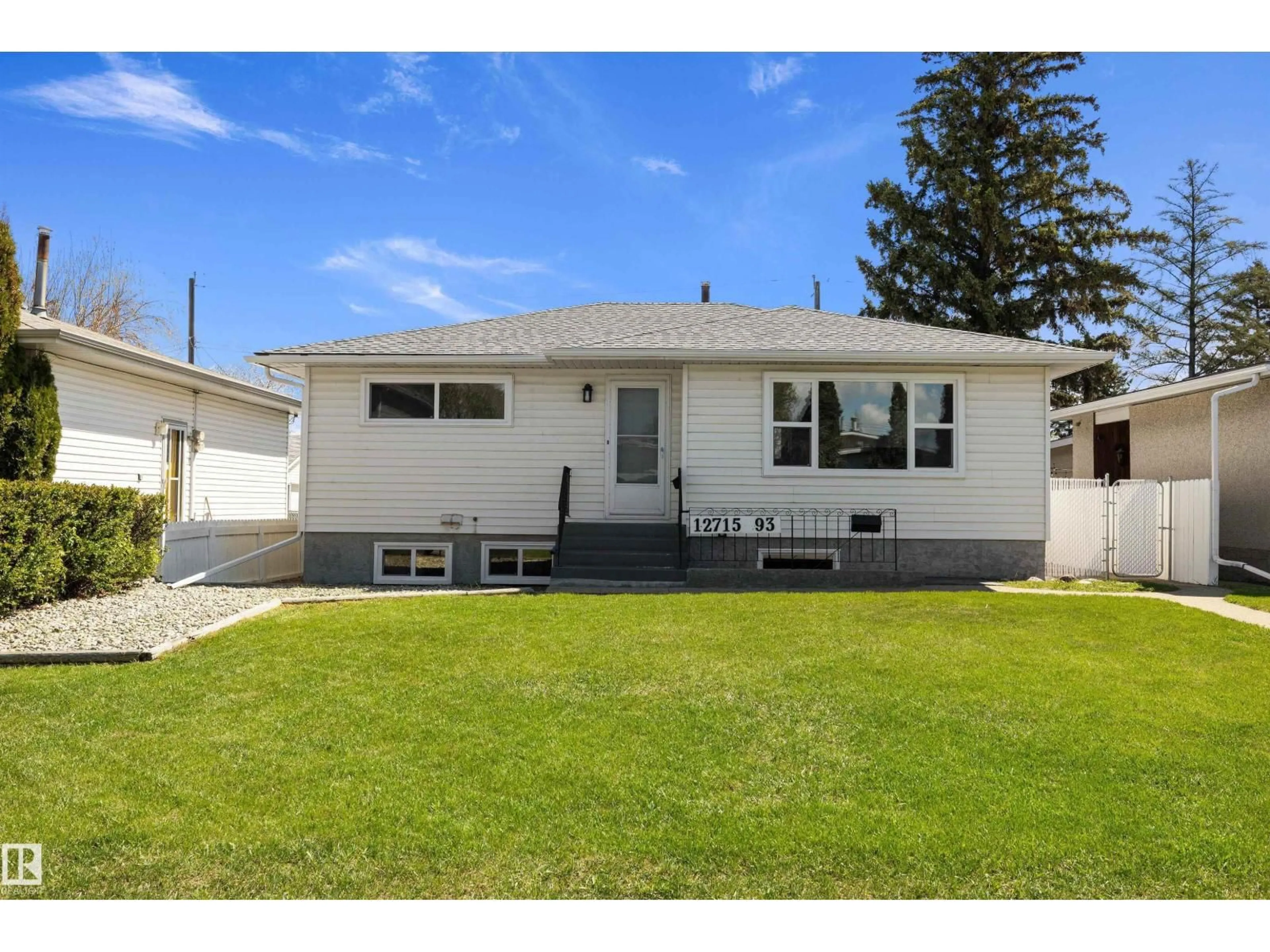 Home with vinyl exterior material, street for NW - 12715 / 12717 93 ST, Edmonton Alberta T5E3S9