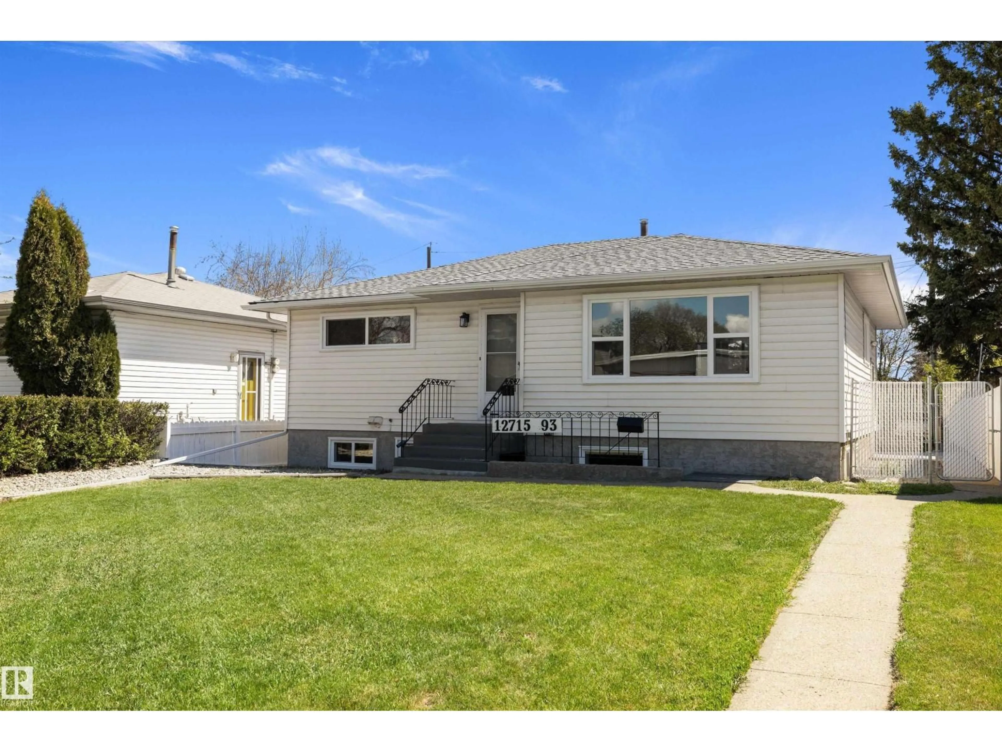 Home with vinyl exterior material, street for NW - 12715 / 12717 93 ST, Edmonton Alberta T5E3S9