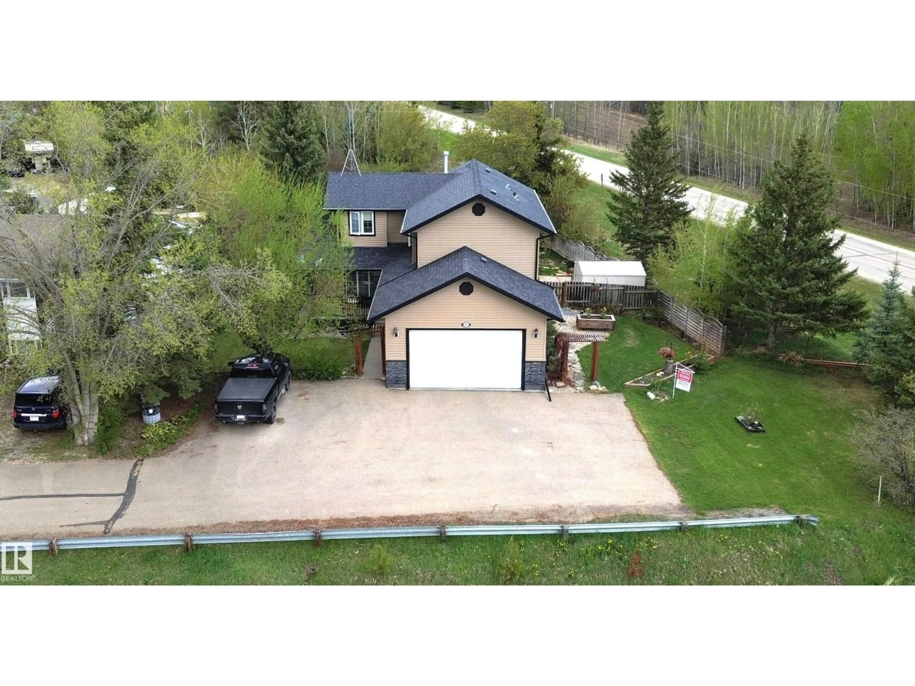 A pic from outside/outdoor area/front of a property/back of a property/a pic from drone, street for 501 LAKESIDE DR, Rural Parkland County Alberta T7Z2V5