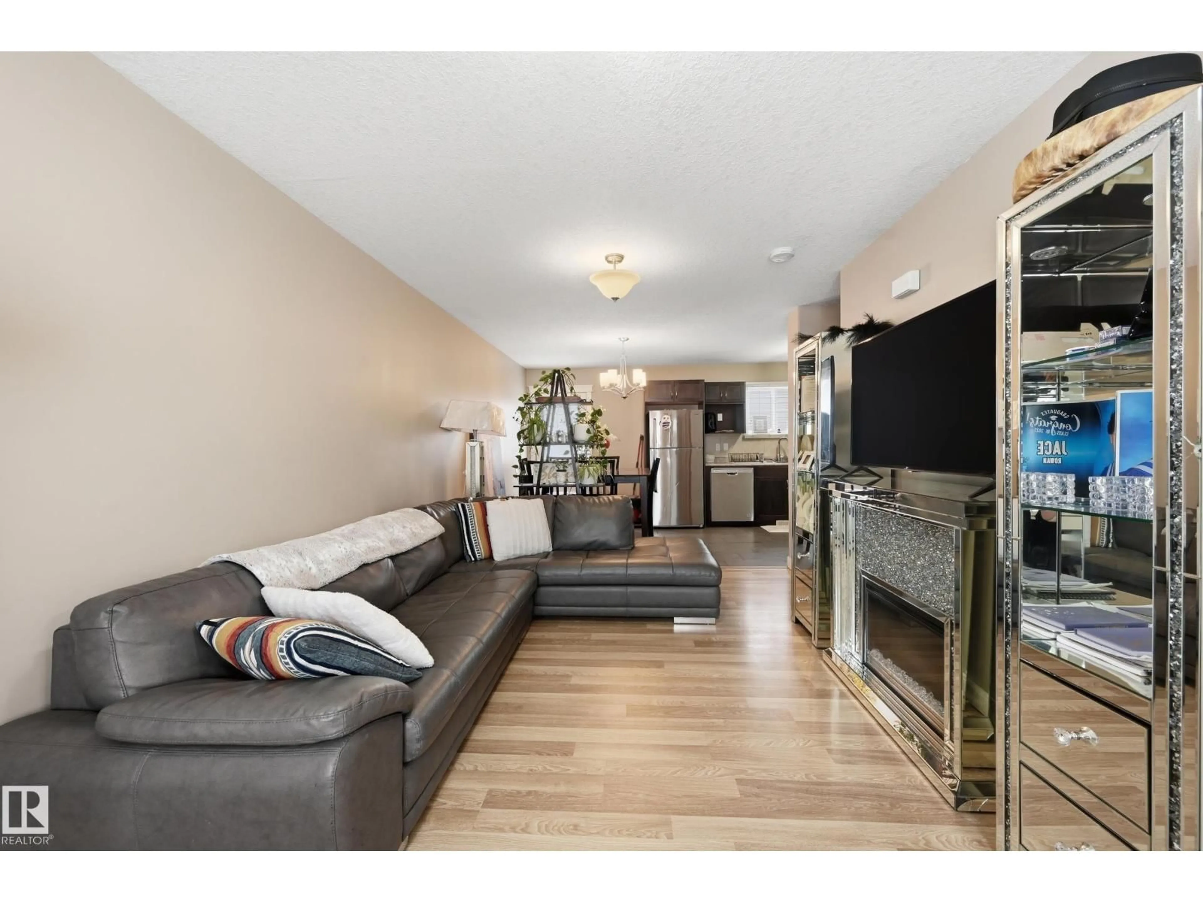 Living room with furniture, wood/laminate floor for 8816/8818/8820 119 AV, Edmonton Alberta T5B0G3