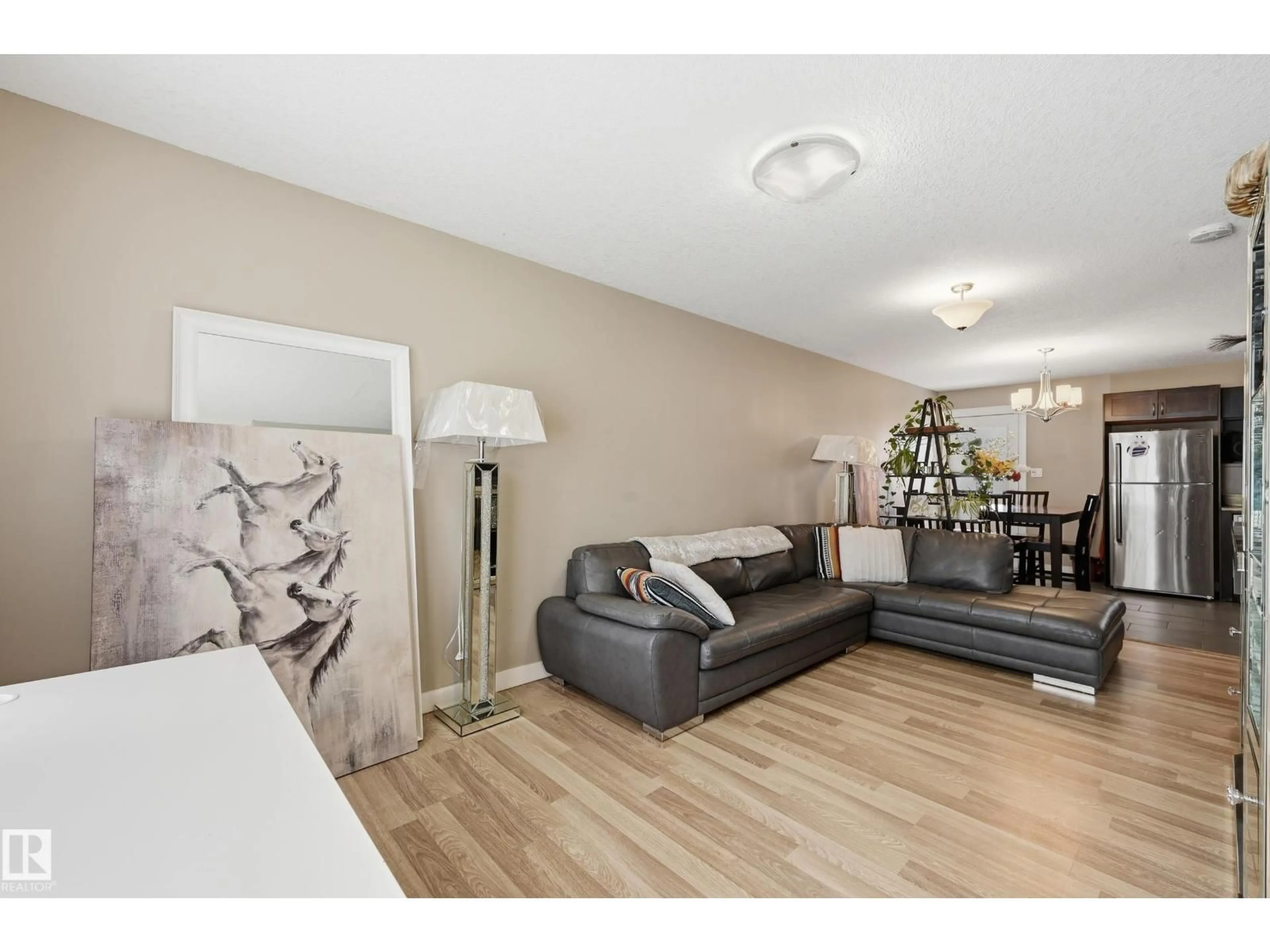 Living room with furniture, wood/laminate floor for 8816/8818/8820 119 AV, Edmonton Alberta T5B0G3