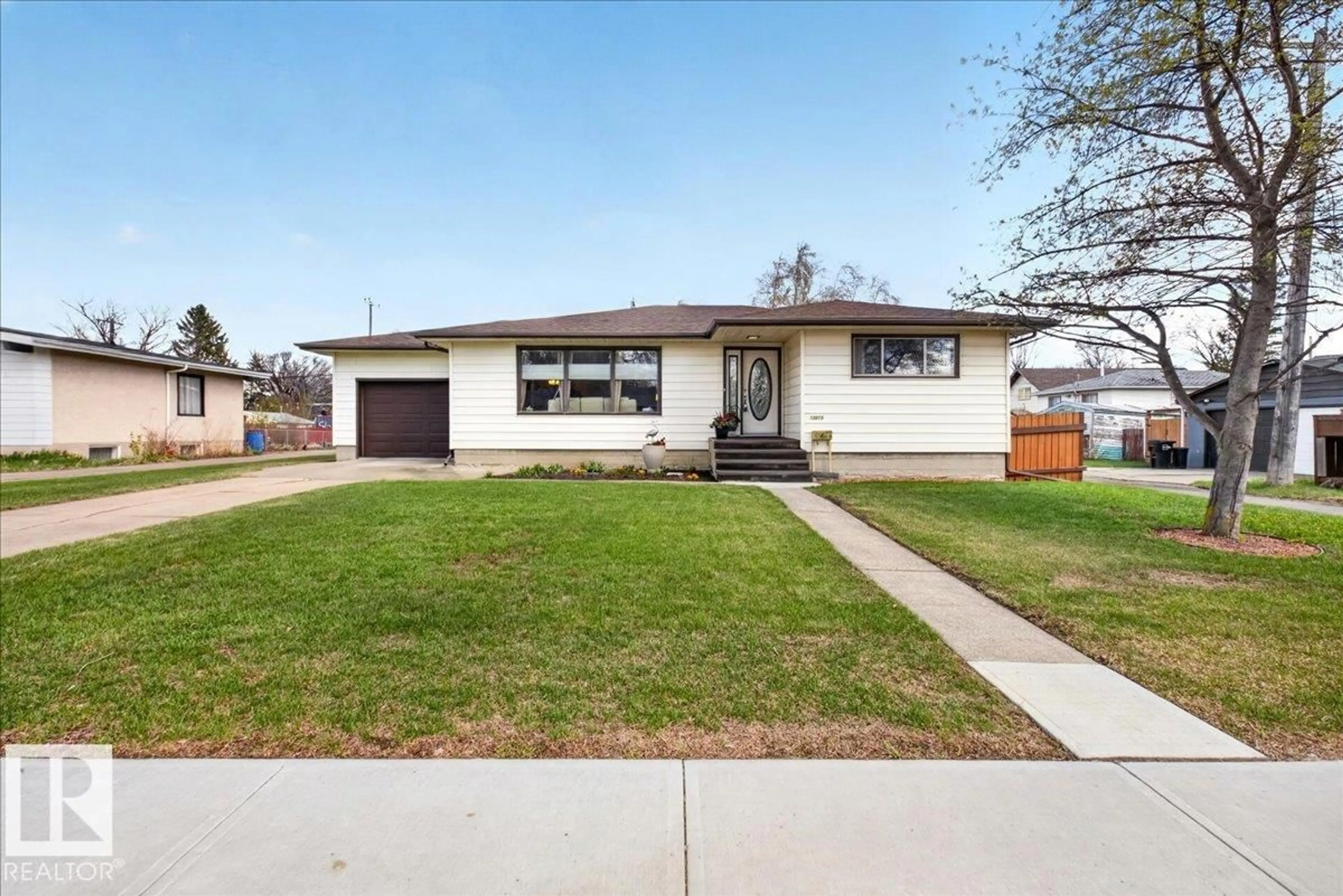 Home with vinyl exterior material, street for NW - 13015 115 ST, Edmonton Alberta T5E5G4