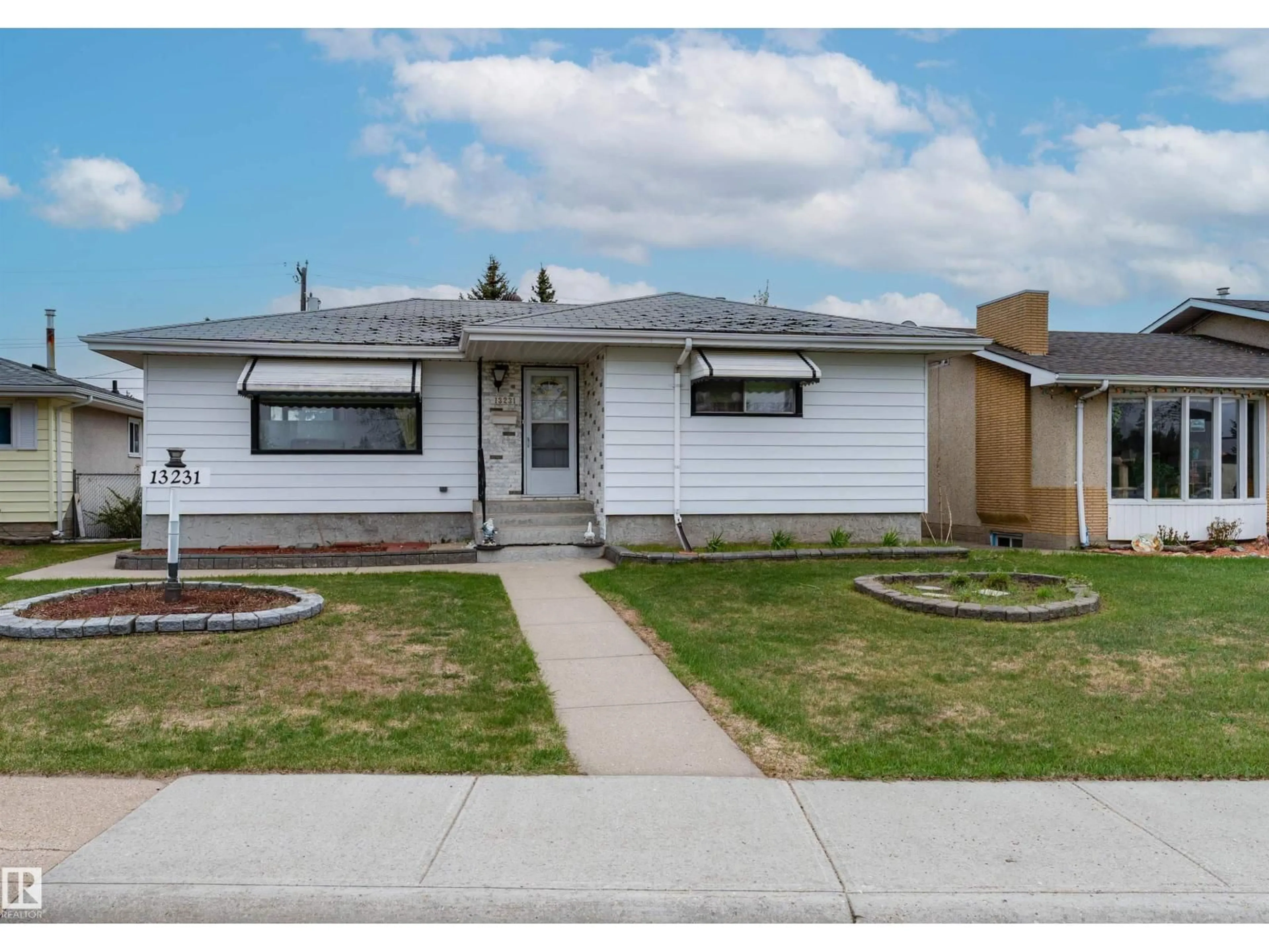 Home with vinyl exterior material, street for NW - 13231 74 ST, Edmonton Alberta T5C0X3