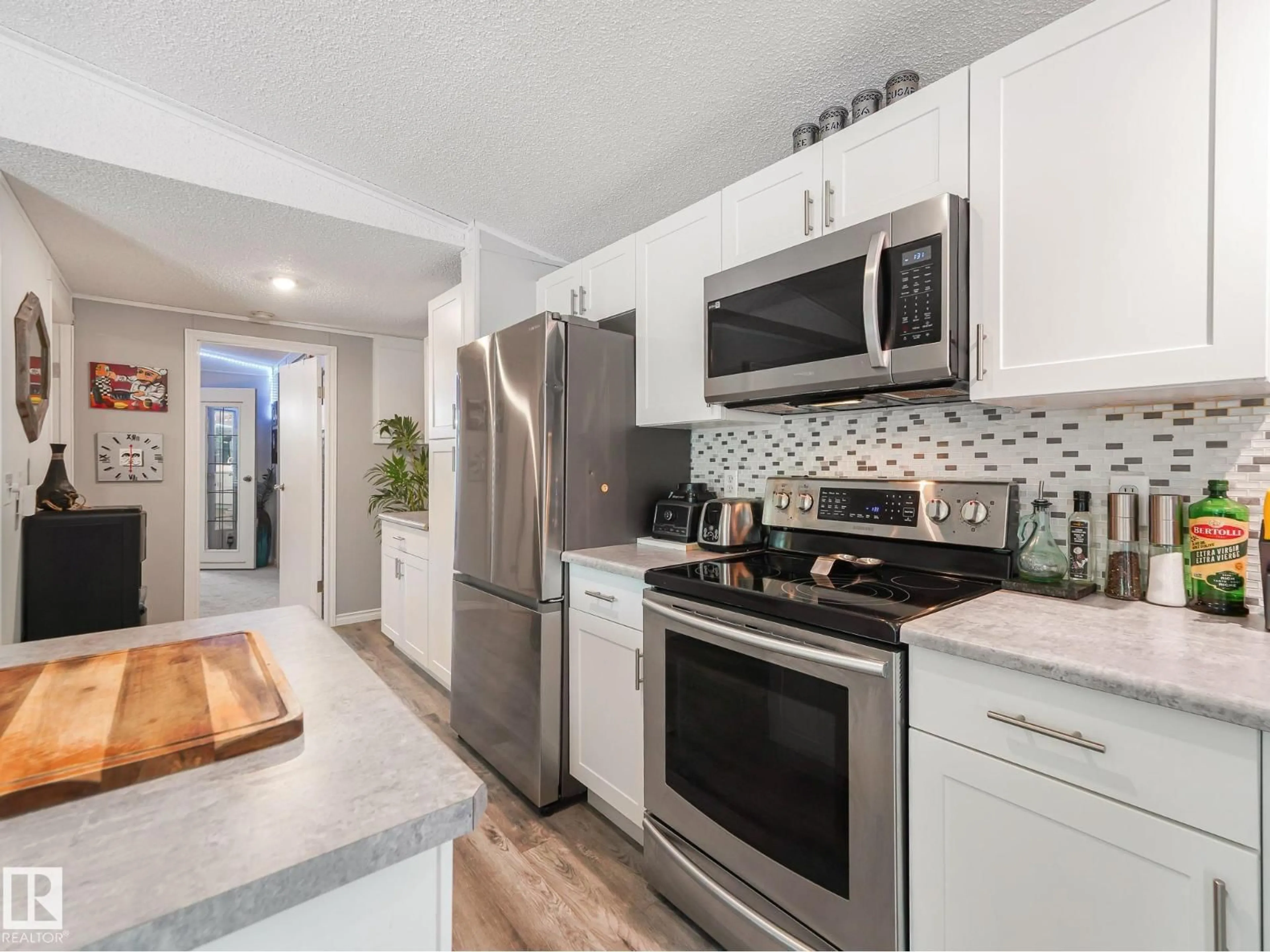 Open concept kitchen, ceramic/tile floor for 57323 - 304 RGRD 30, Rural Barrhead County Alberta T0E1A0