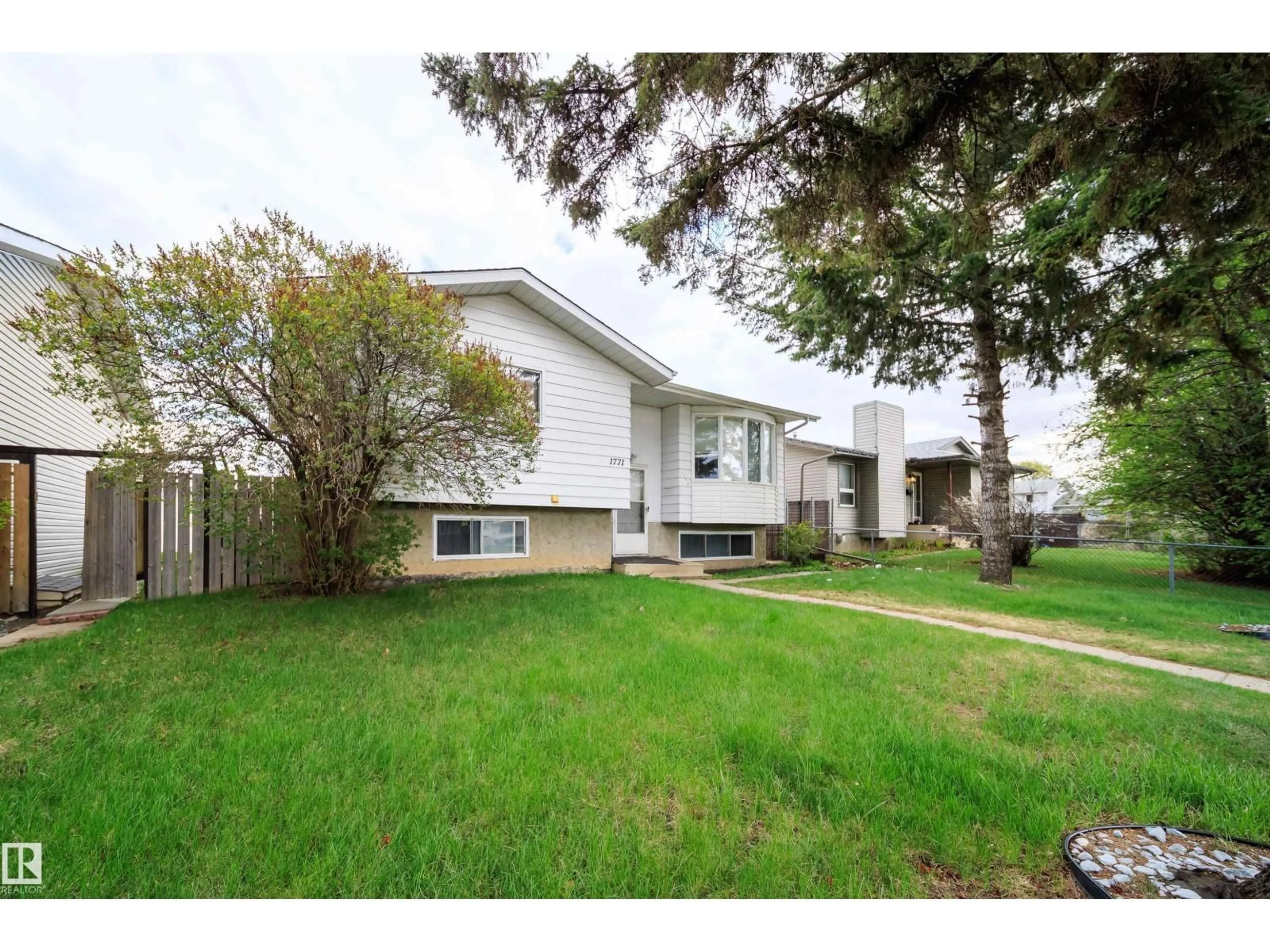 Home with vinyl exterior material, street for 1771 37 ST, Edmonton Alberta T6L3G7