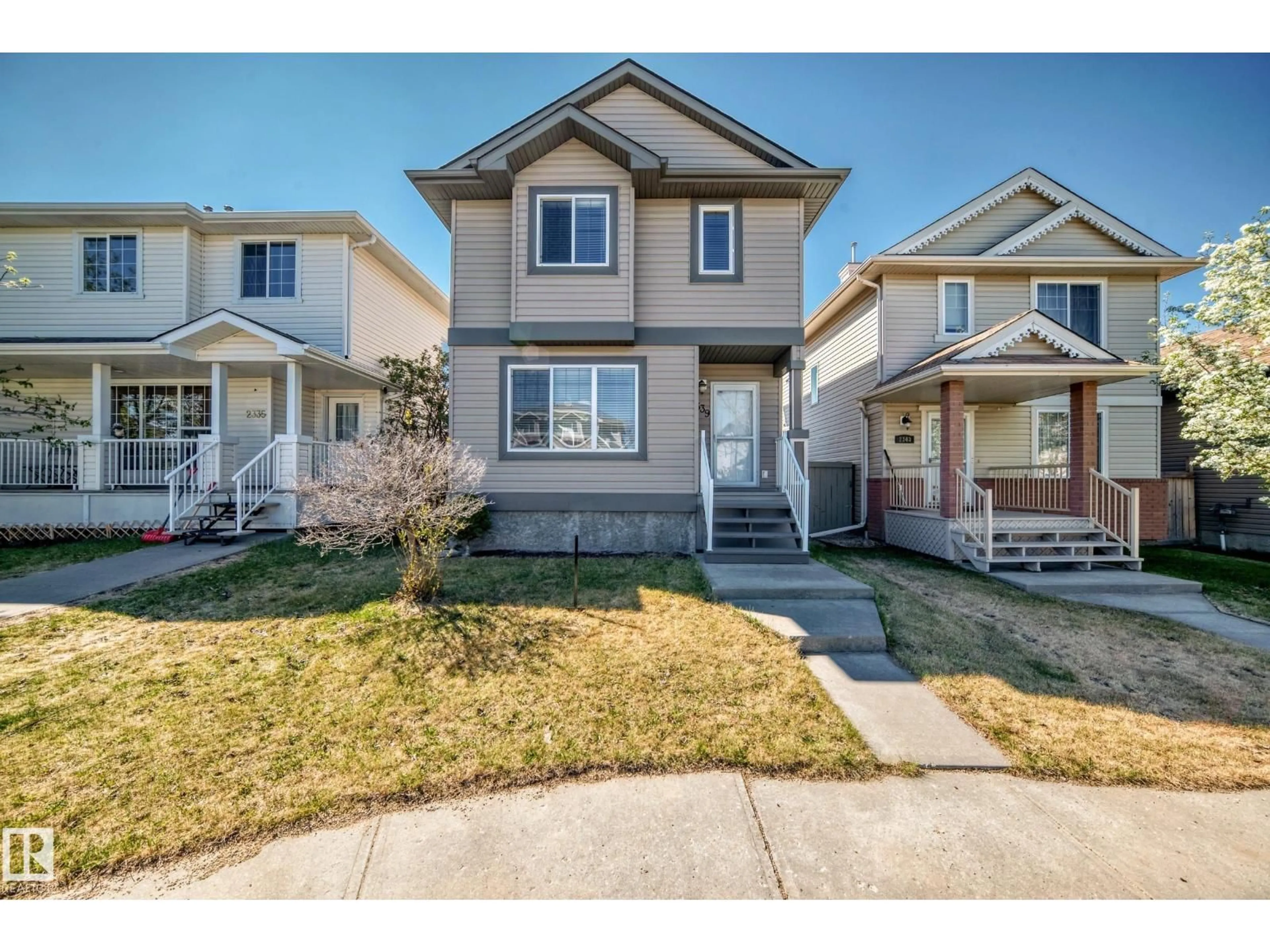 Home with vinyl exterior material, street for 2339 28B AVE AV, Edmonton Alberta T6T2A4