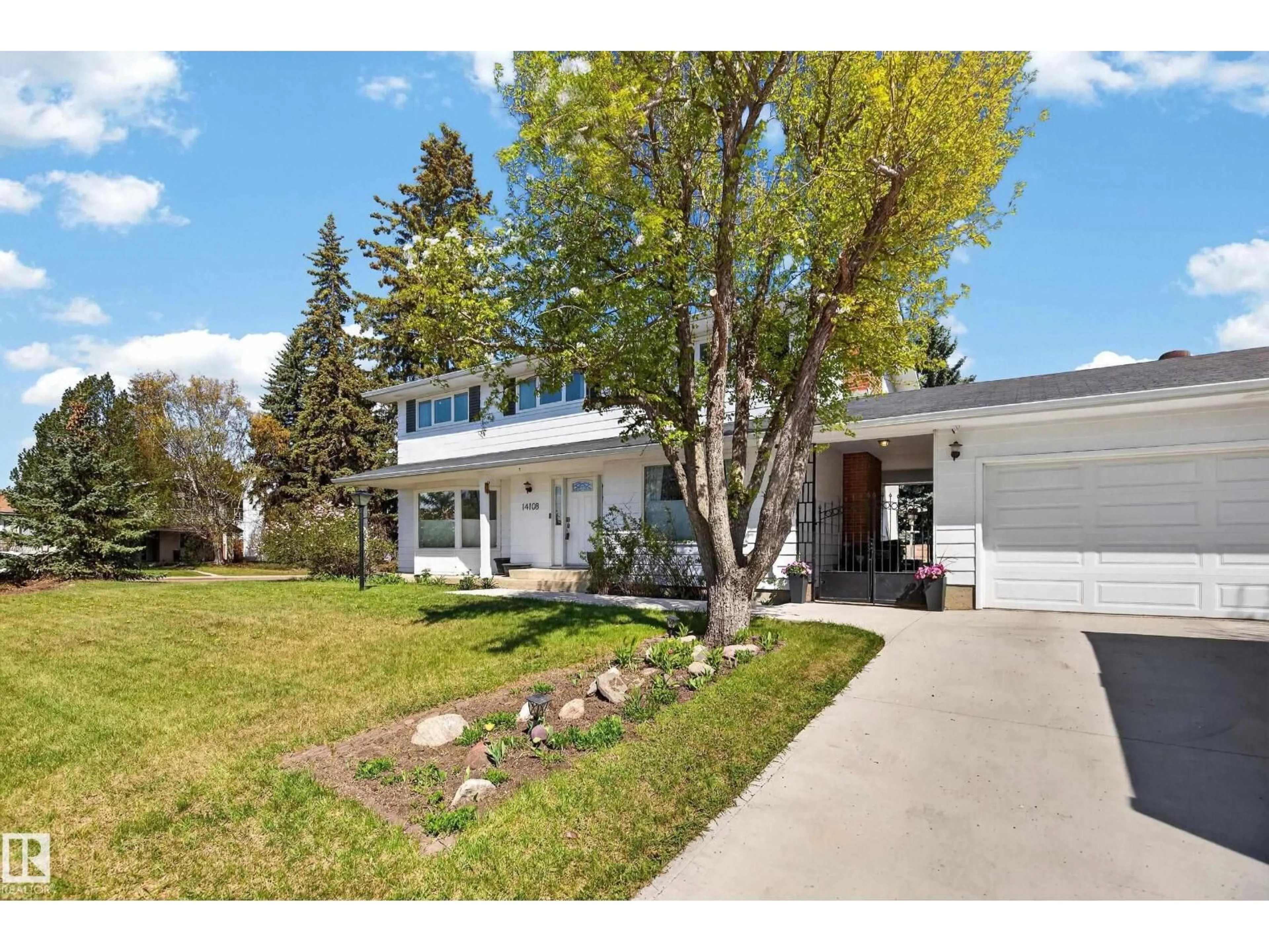 Home with vinyl exterior material, street for 14108 47 AV, Edmonton Alberta T6H0B7