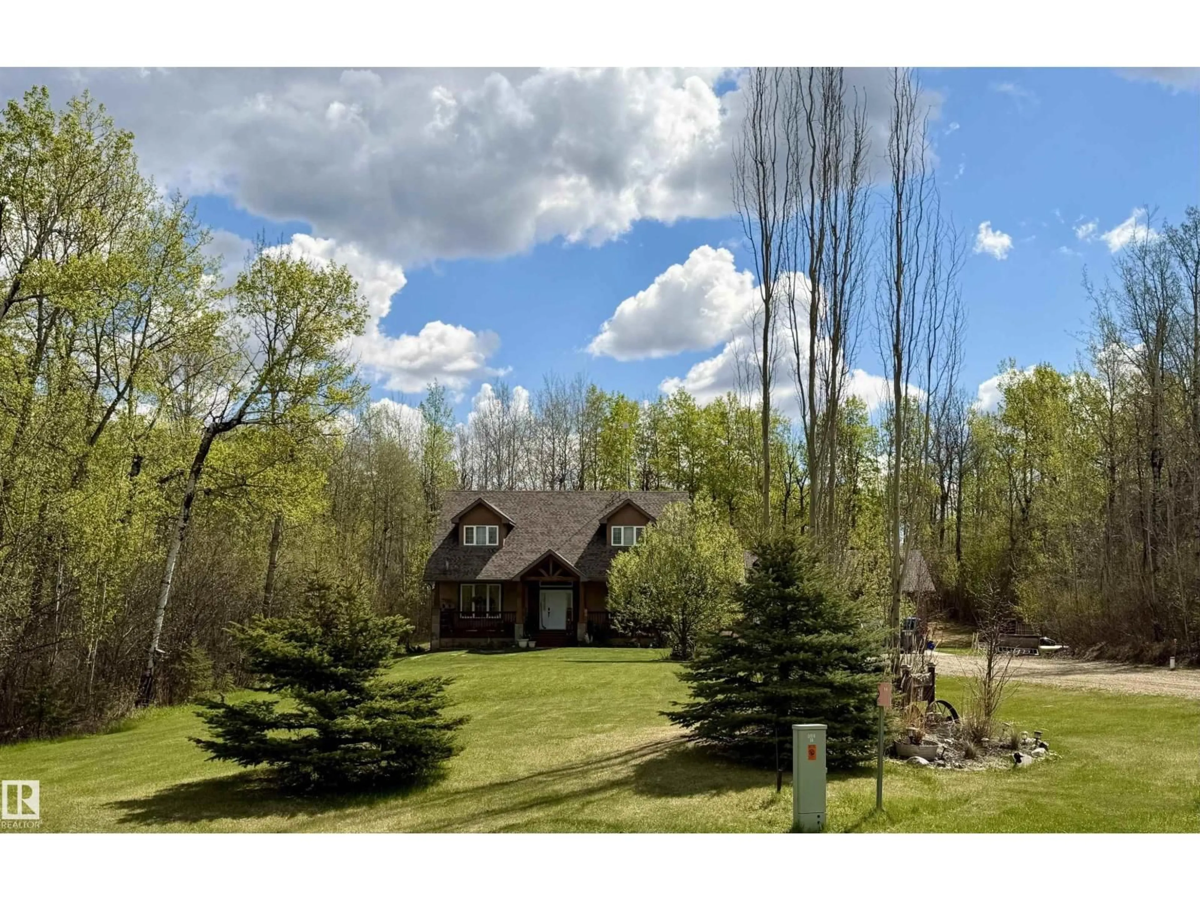 A pic from outside/outdoor area/front of a property/back of a property/a pic from drone, forest/trees view for 34 - 54419 RGE ROAD 14, Rural Lac Ste. Anne County Alberta T0E1V0