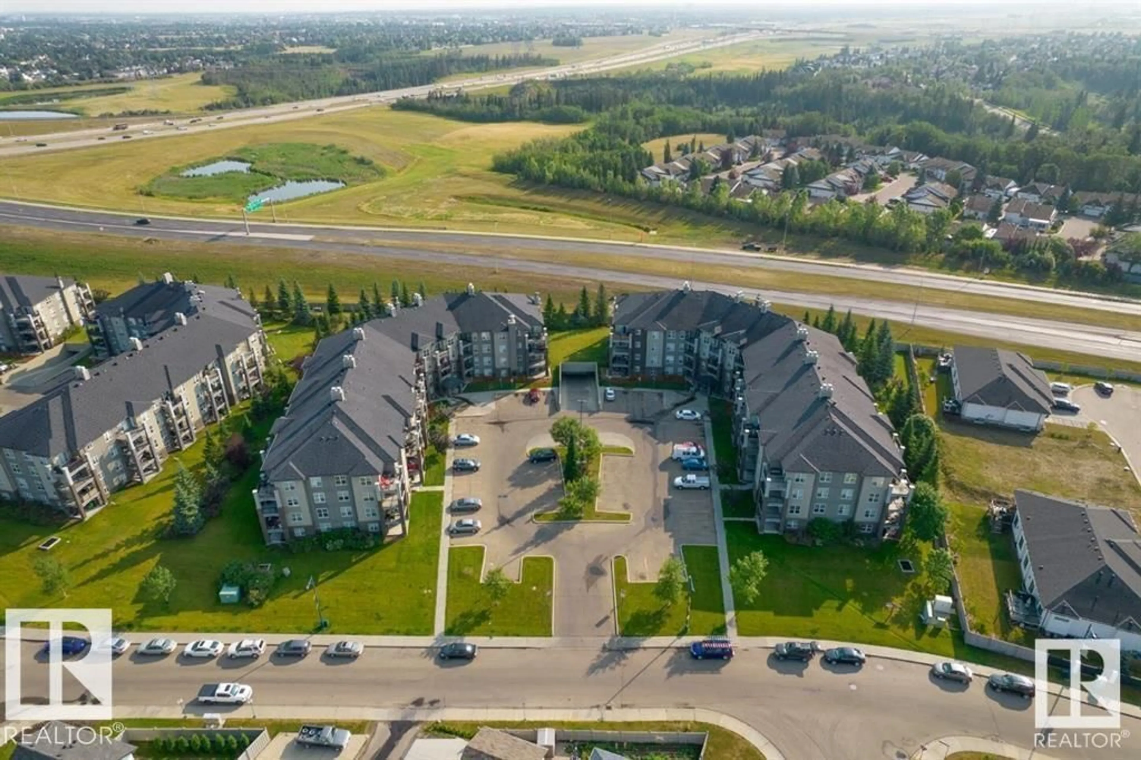 A pic from outside/outdoor area/front of a property/back of a property/a pic from drone, unknown for 101 - 630 MCALLISTER LO, Edmonton Alberta T6W1N3
