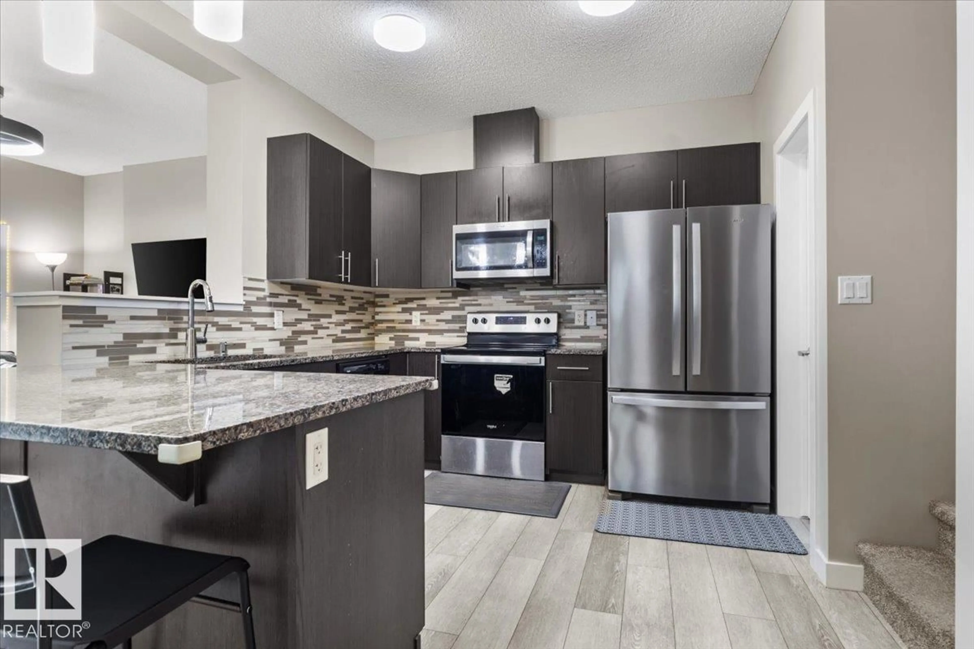 Open concept kitchen, ceramic/tile floor for 236 39 AV NW, Edmonton Alberta T6T2K3