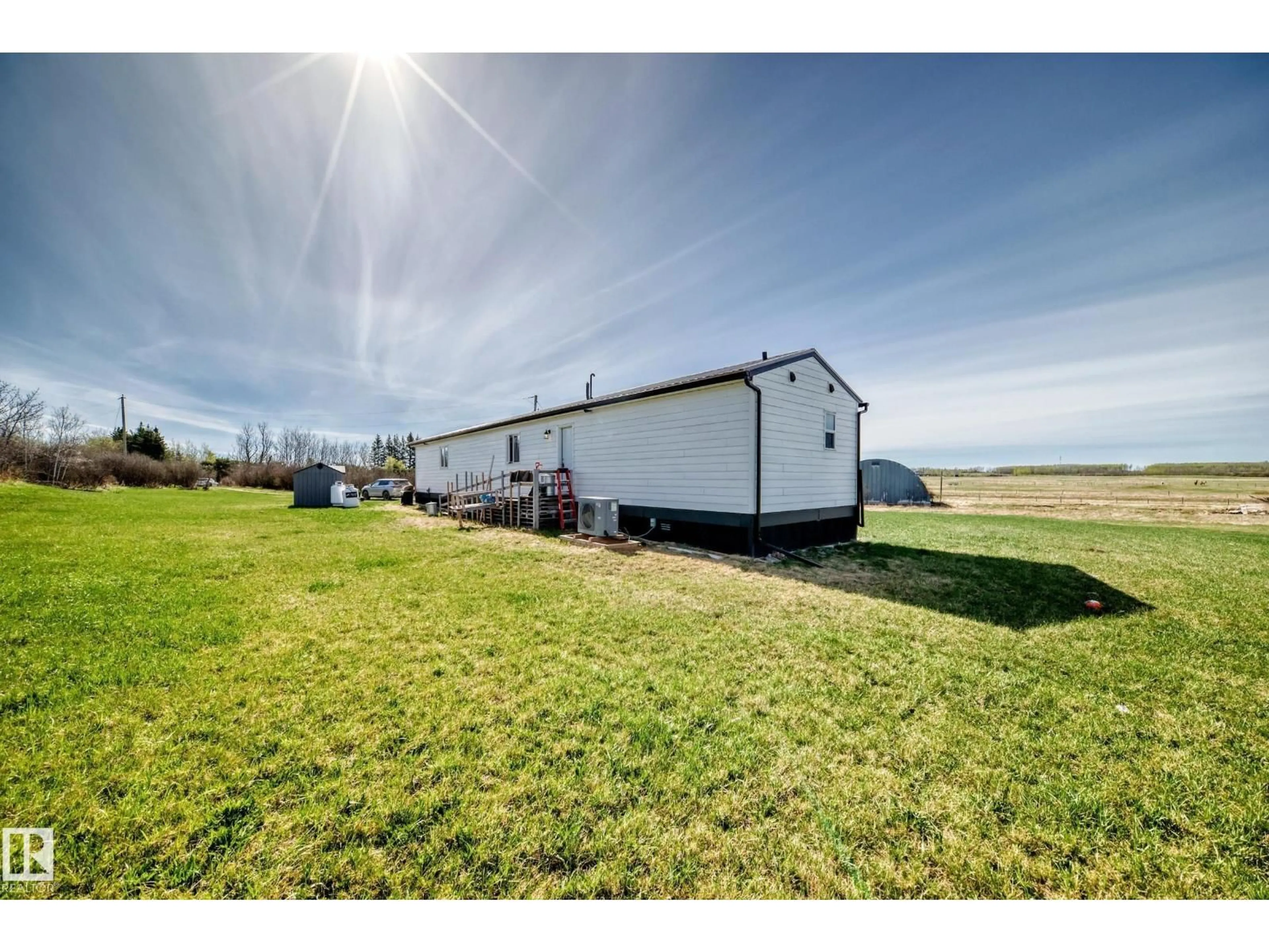A pic from outside/outdoor area/front of a property/back of a property/a pic from drone, water/lake/river/ocean view for 56432 HWY 777, Rural Barrhead County Alberta T7N0L6