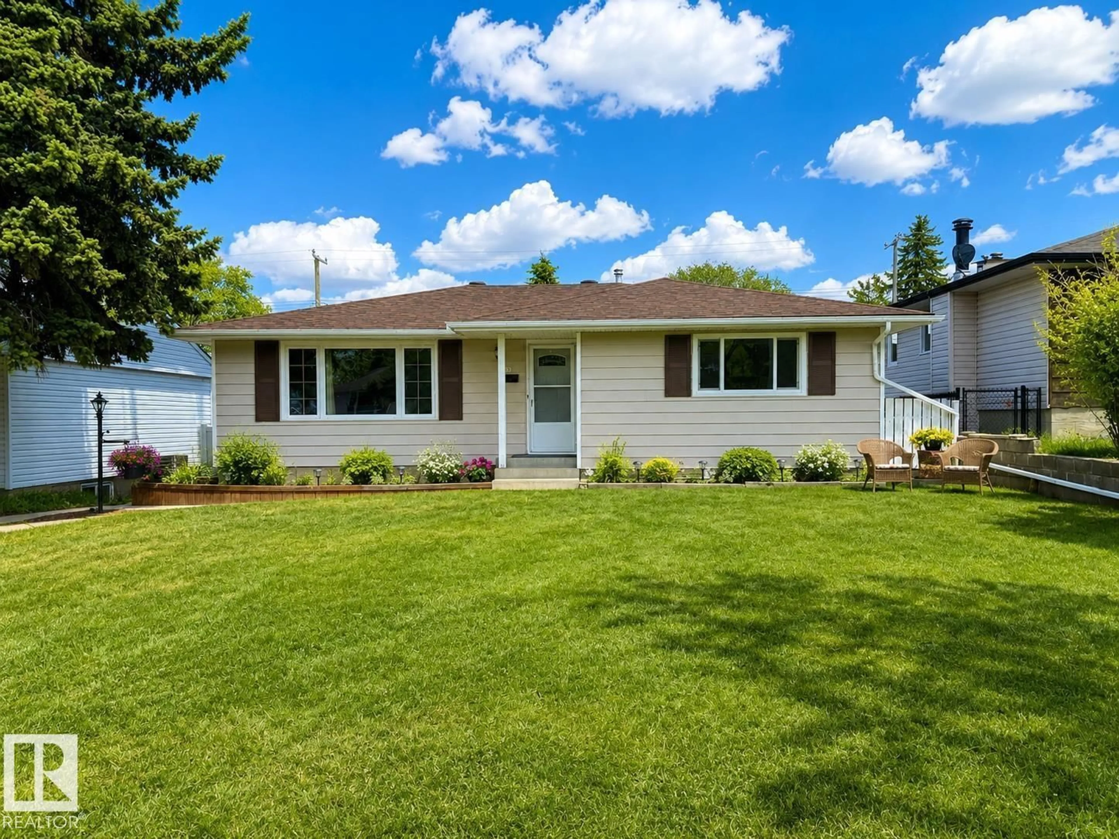 Home with vinyl exterior material, street for NW - 10807 52 ST, Edmonton Alberta T6A2H4