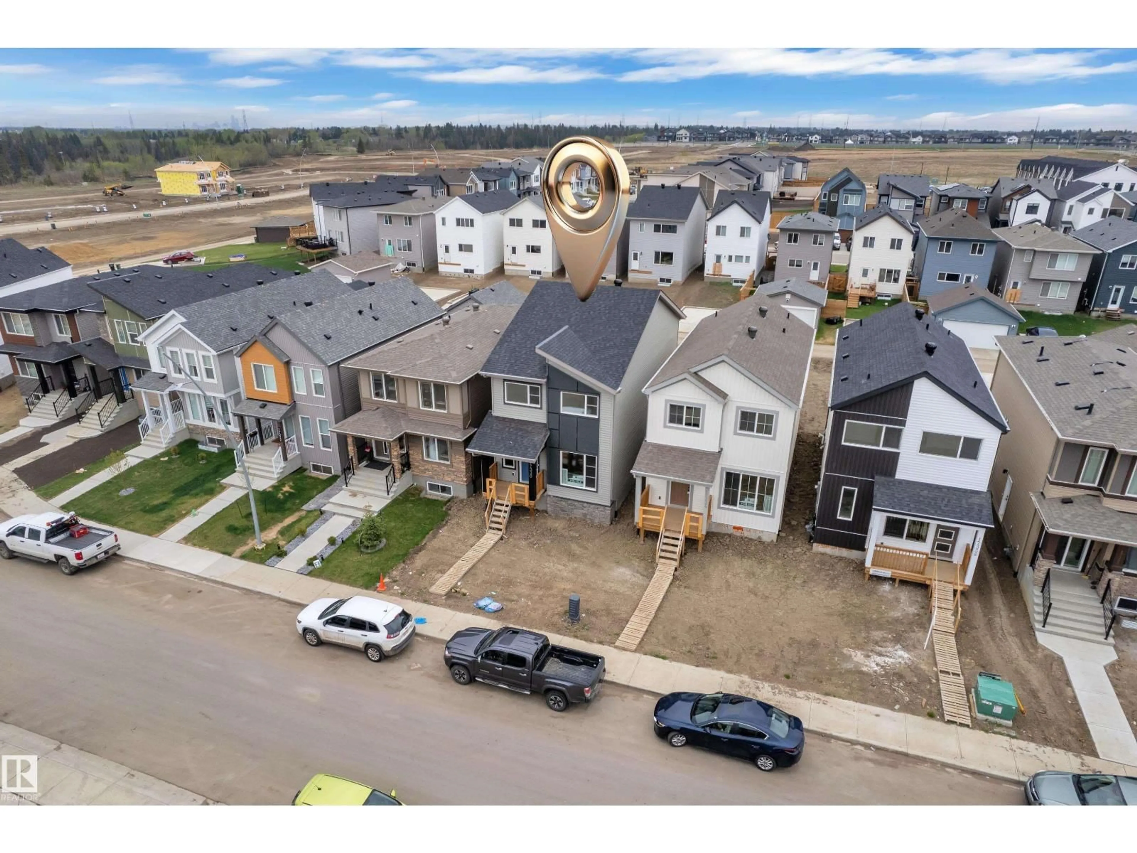 A pic from outside/outdoor area/front of a property/back of a property/a pic from drone, street for NE - 17330 6A ST, Edmonton Alberta T5Y4E8