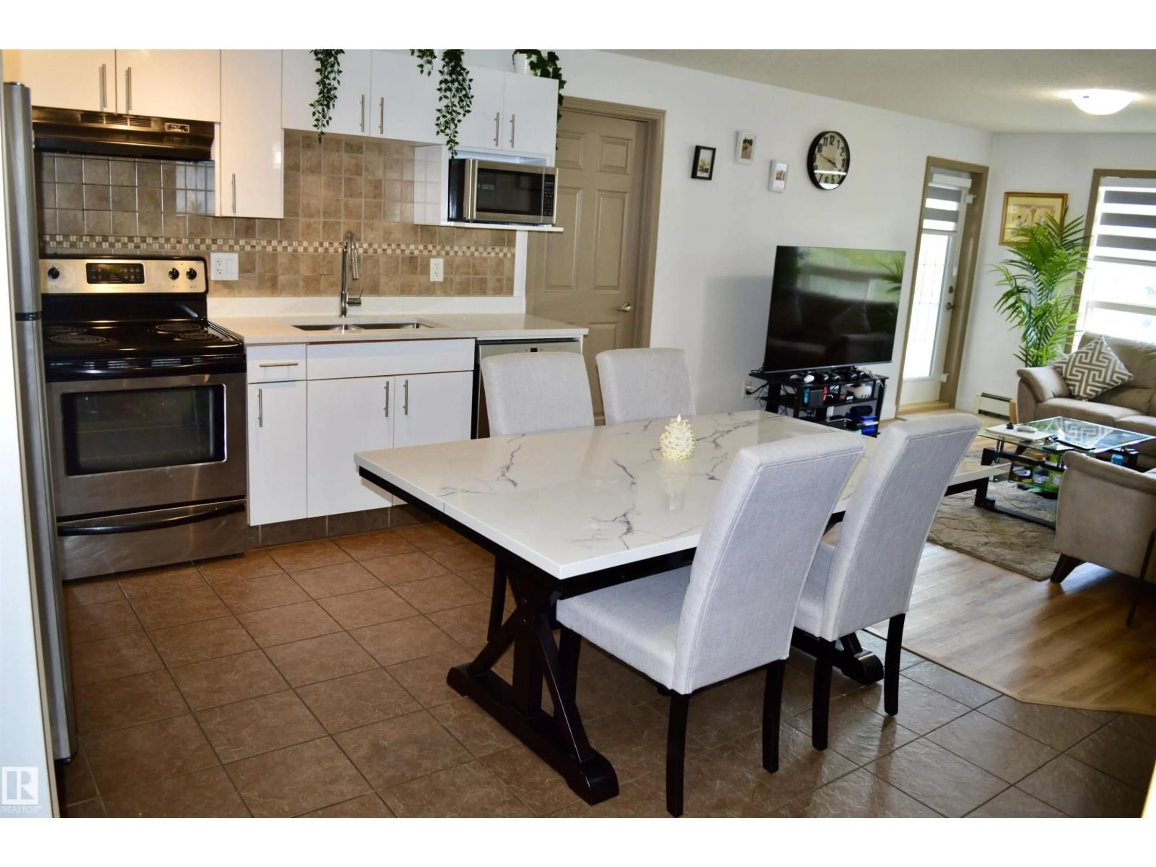 Open concept kitchen, ceramic/tile floor for 210 - 5005 165 AV, Edmonton Alberta T5Y0L8
