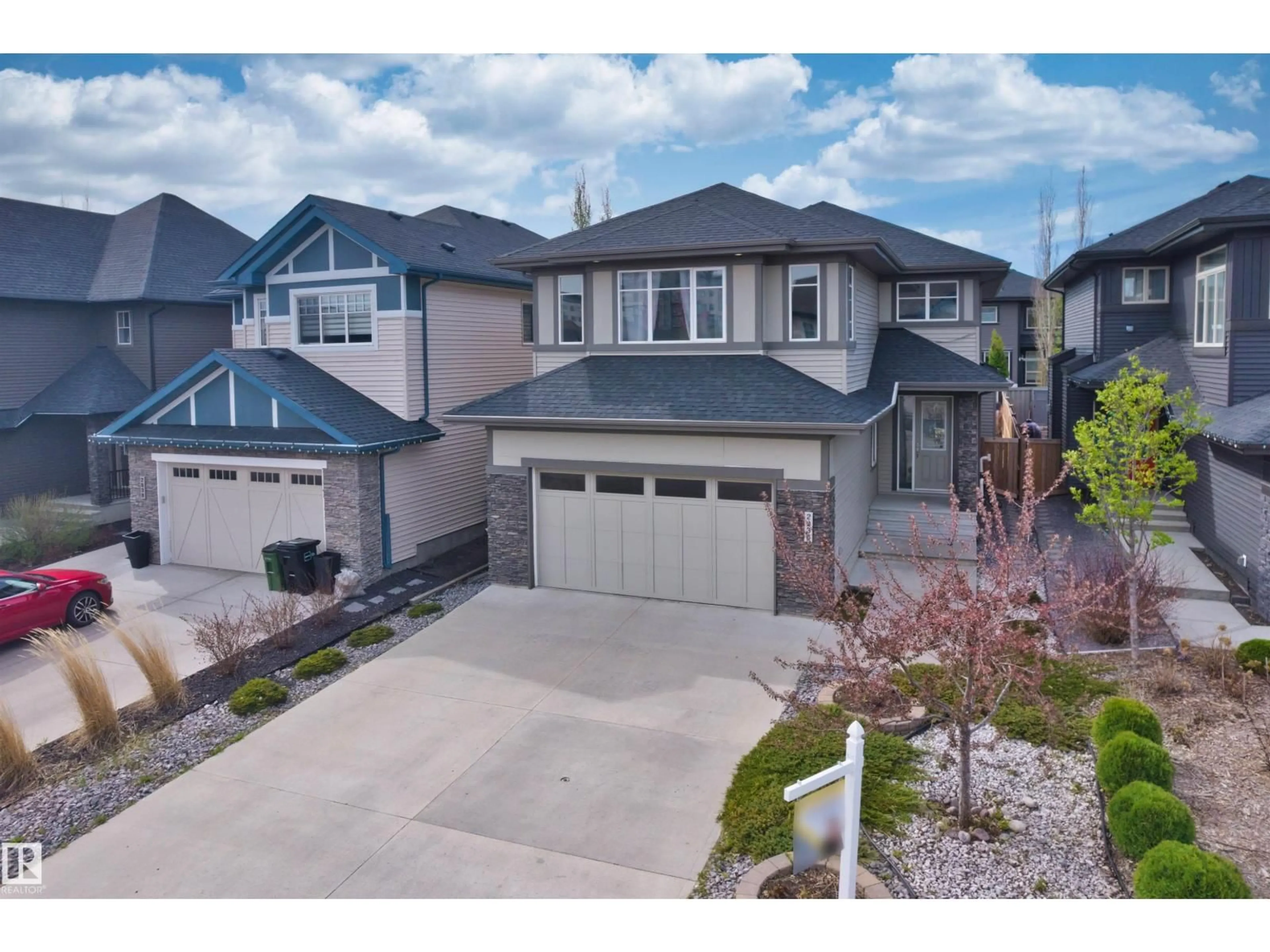 A pic from outside/outdoor area/front of a property/back of a property/a pic from drone, street for LI SW - 2036 AINSLIE LINK, Edmonton Alberta T6W2M2