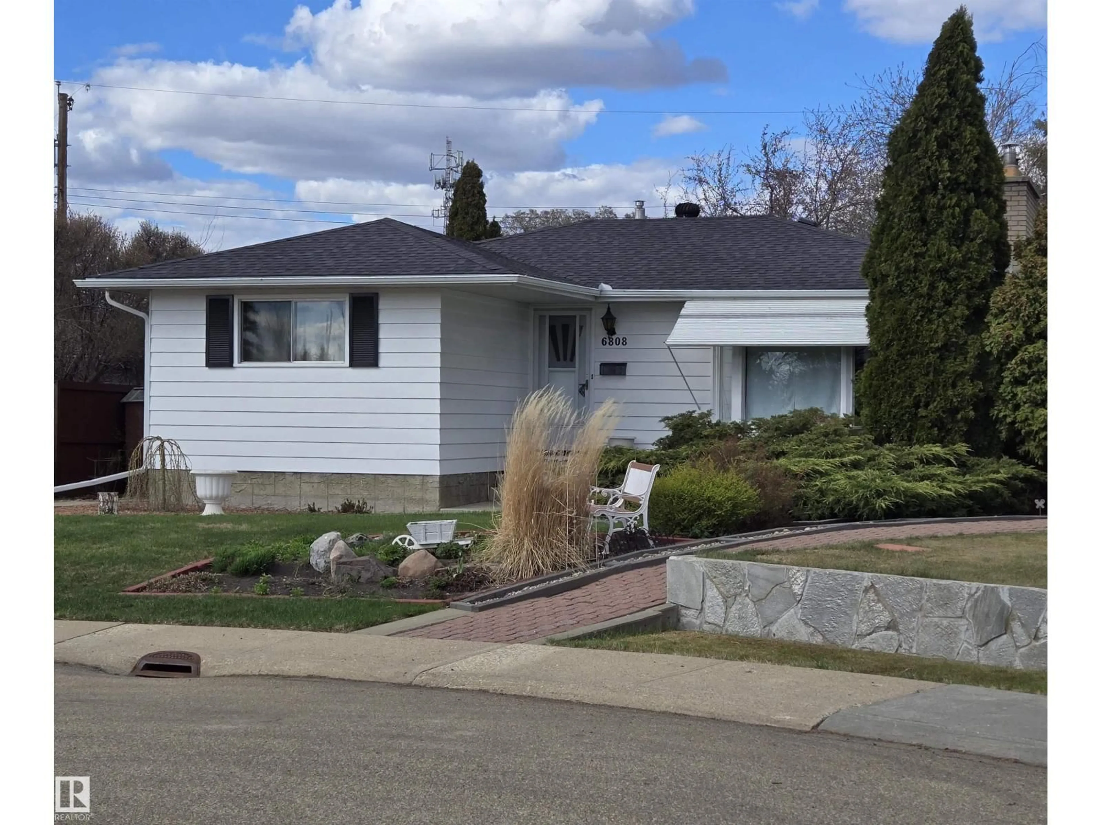 Home with vinyl exterior material, street for 6808 135A AV, Edmonton Alberta T5C2H6
