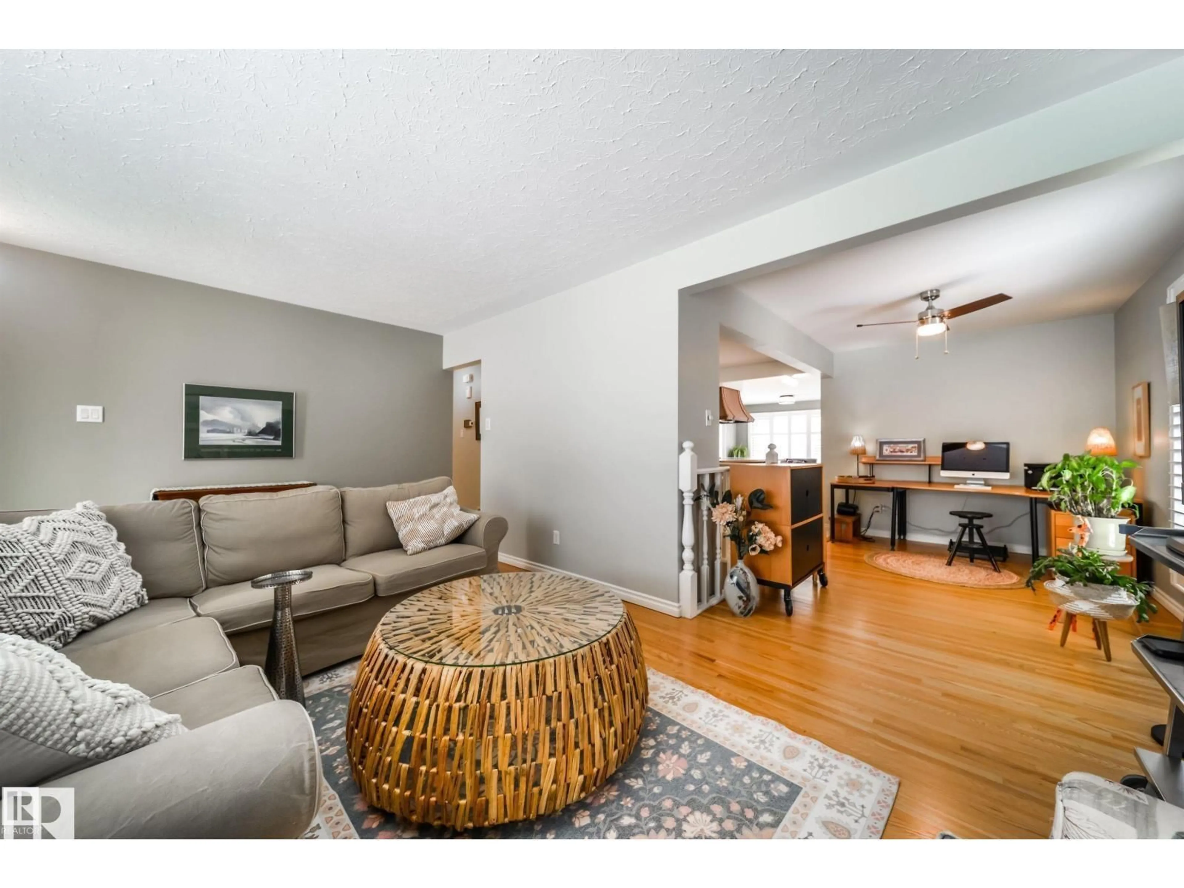 Living room with furniture, wood/laminate floor for 10231 46 ST, Edmonton Alberta T6A1X9
