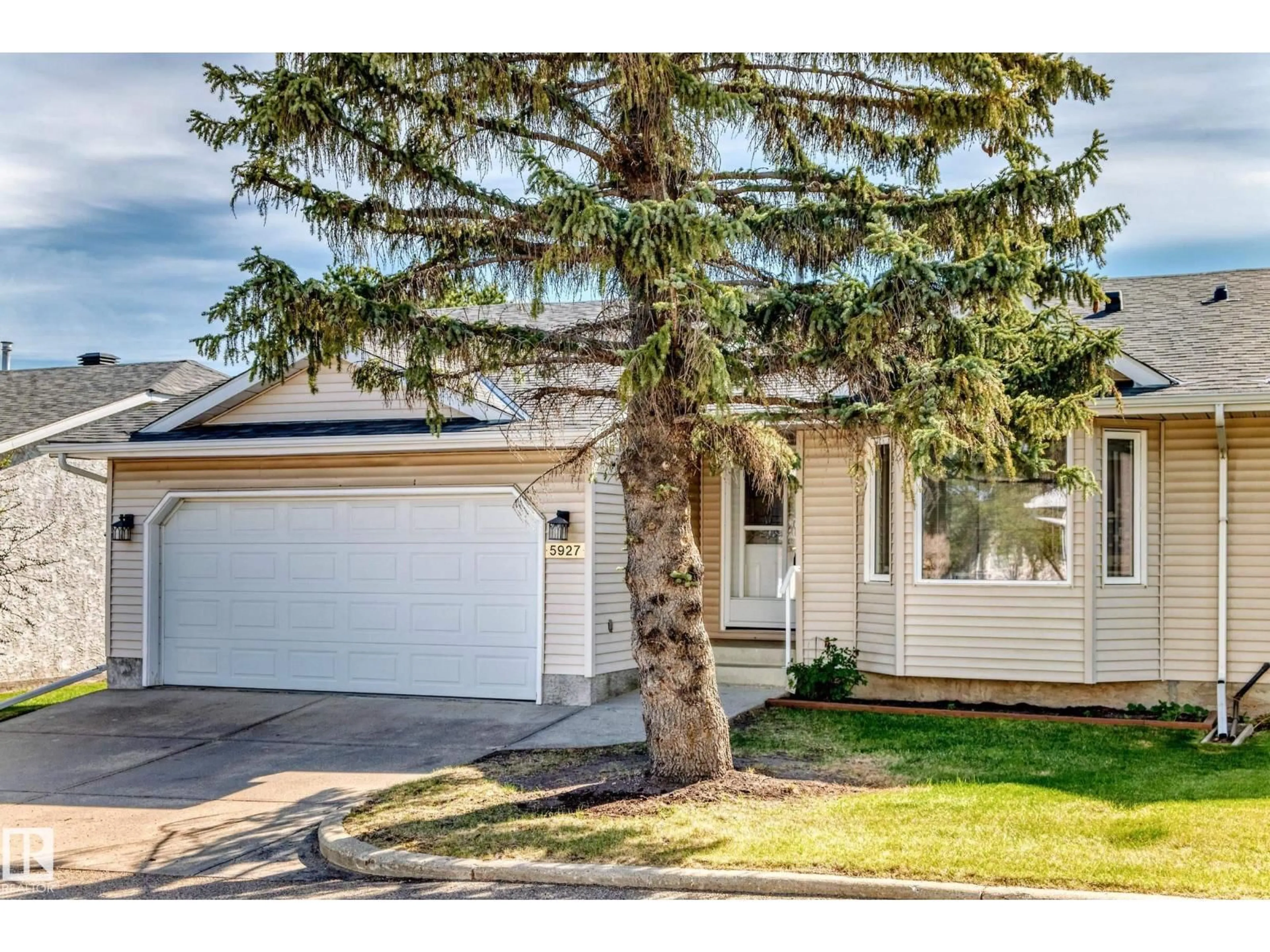 Home with vinyl exterior material, street for NW - 5927 189 ST, Edmonton Alberta T6M2J1