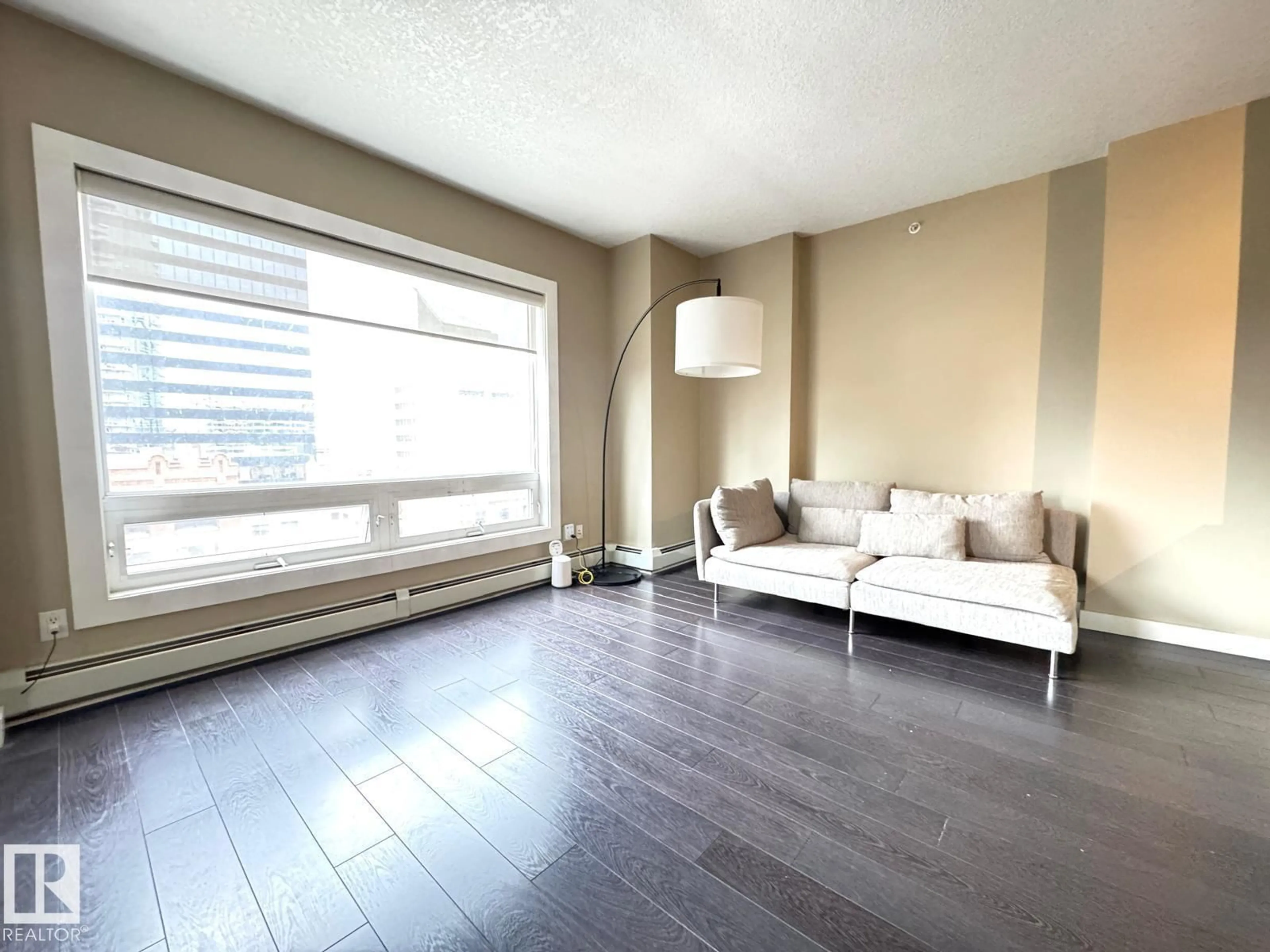 Living room with furniture, wood/laminate floor for #702 - 10136 104 ST NW, Edmonton Alberta T5J0B5