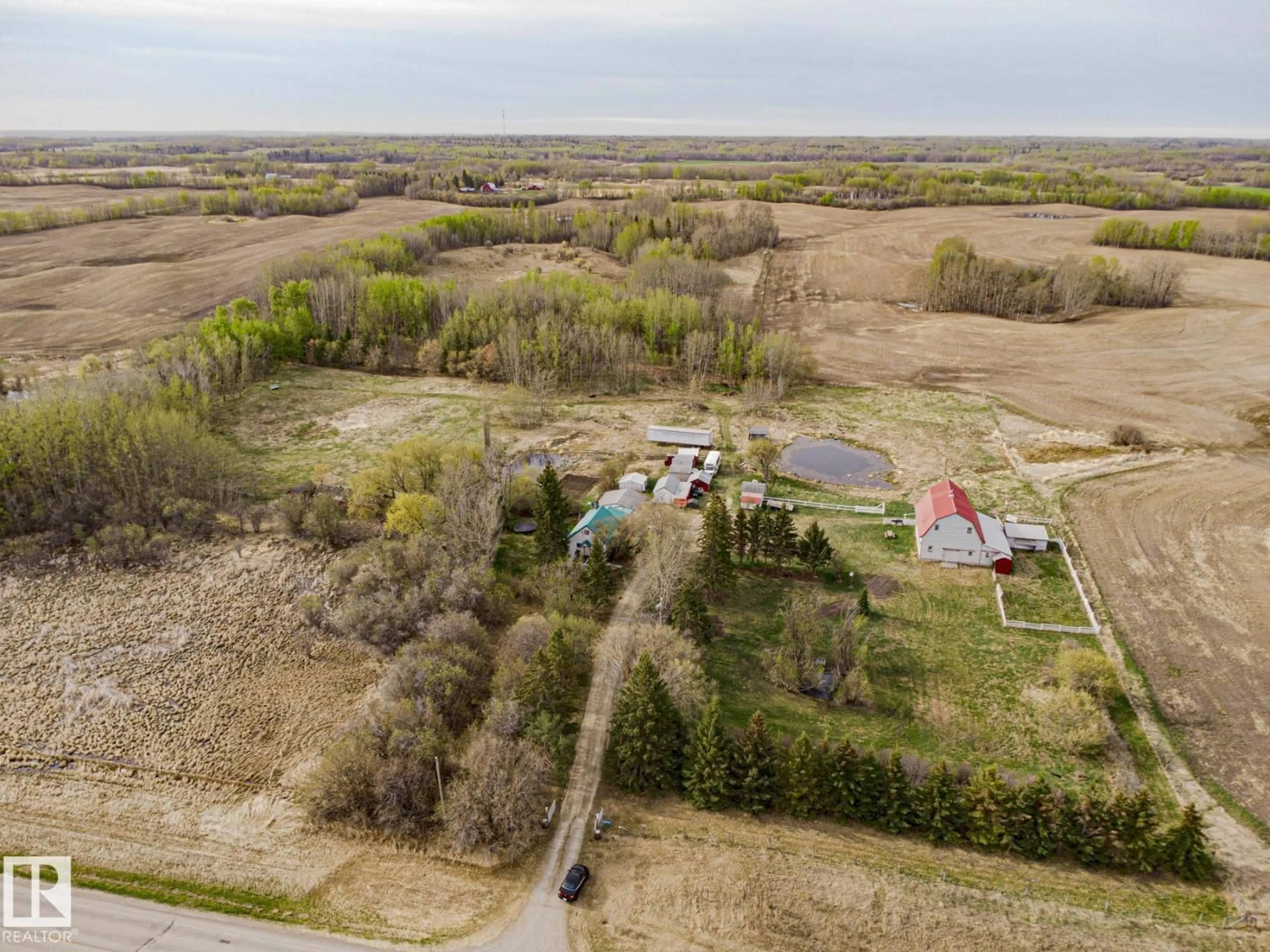 A pic from outside/outdoor area/front of a property/back of a property/a pic from drone, unknown for 2409 HWY 633 NW, Rural Lac Ste. Anne County Alberta T0E0J0