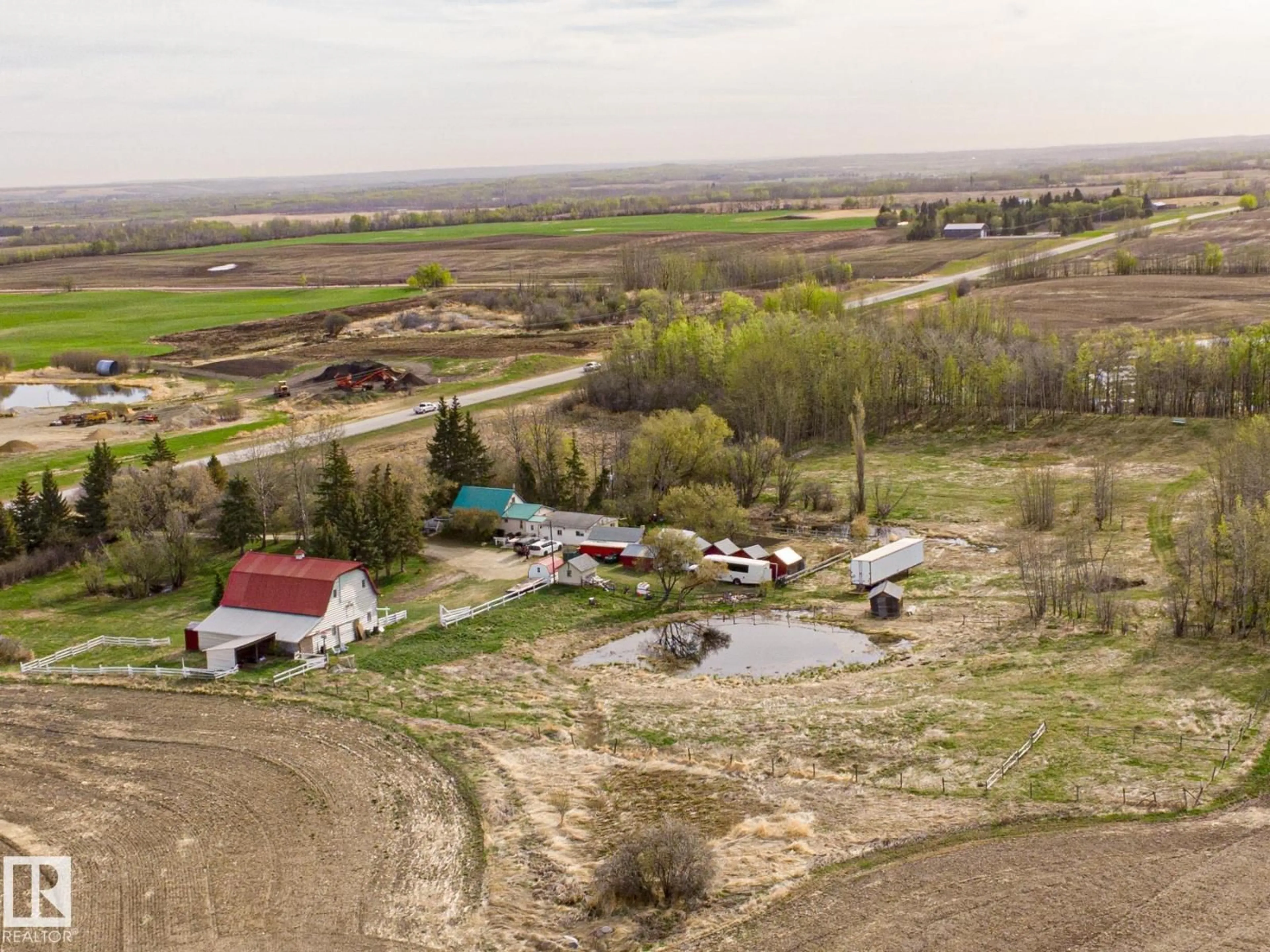 A pic from outside/outdoor area/front of a property/back of a property/a pic from drone, mountain view for 2409 HWY 633 NW, Rural Lac Ste. Anne County Alberta T0E0J0