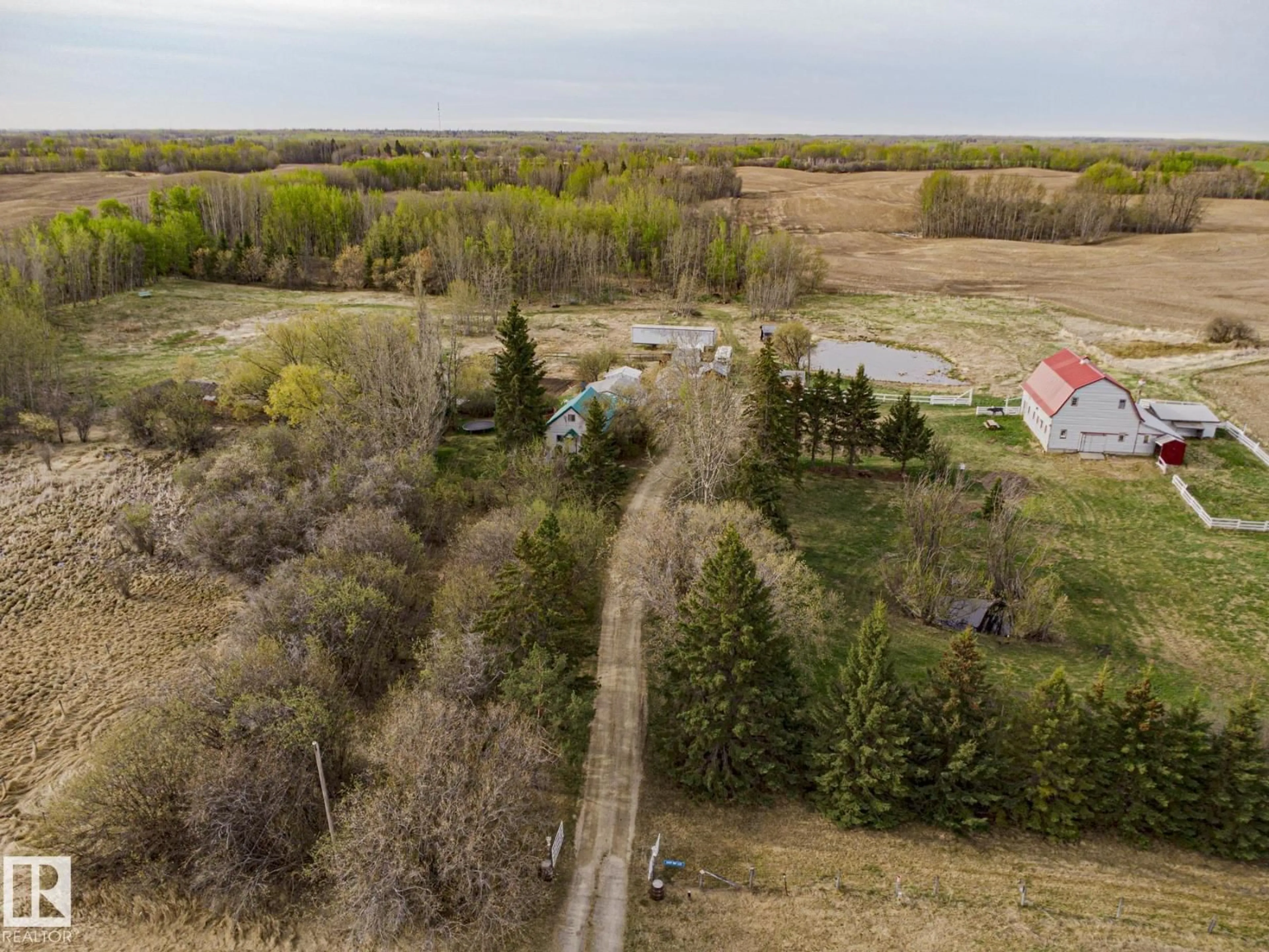 A pic from outside/outdoor area/front of a property/back of a property/a pic from drone, forest/trees view for 2409 HWY 633 NW, Rural Lac Ste. Anne County Alberta T0E0J0