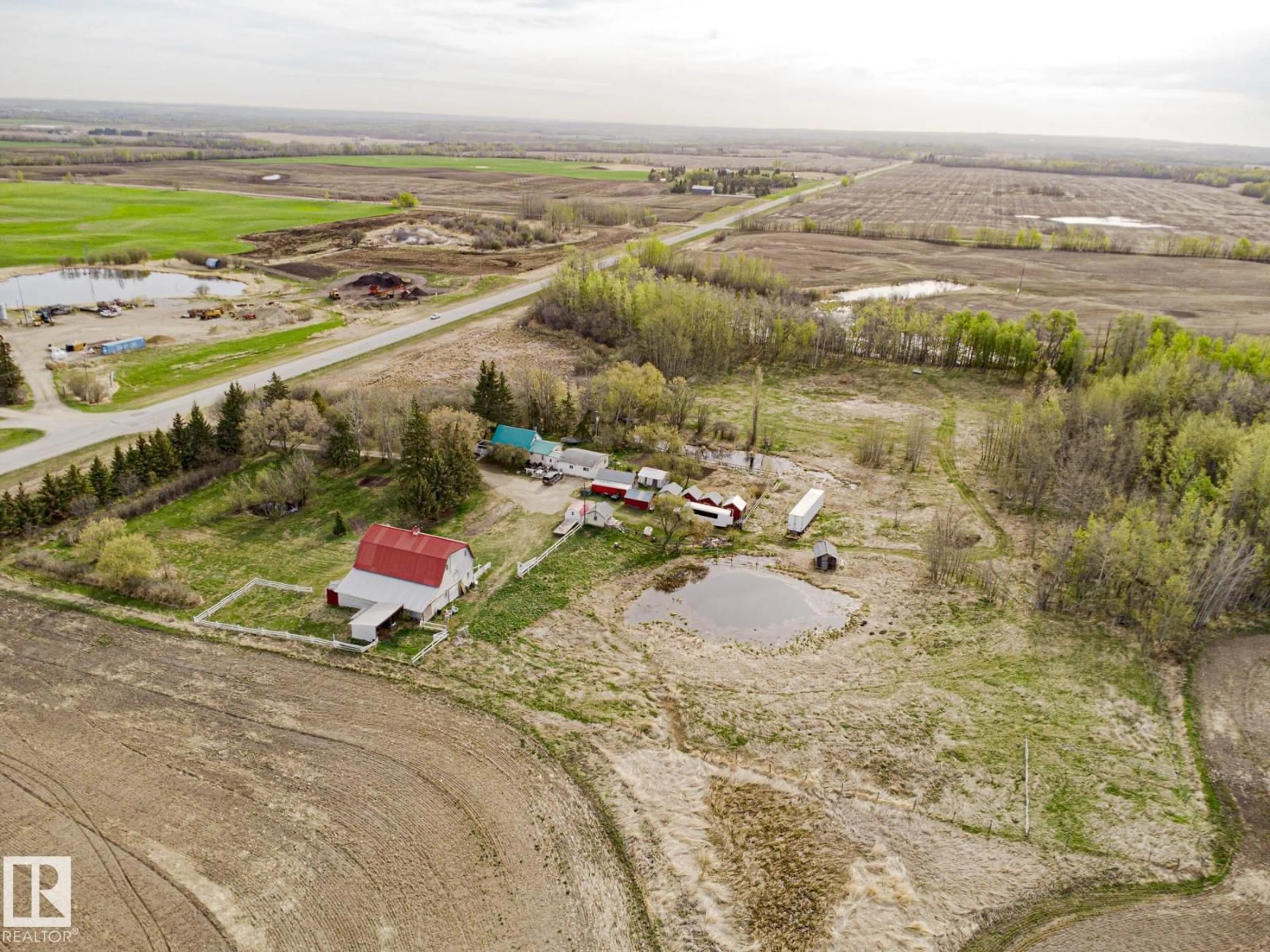 A pic from outside/outdoor area/front of a property/back of a property/a pic from drone, unknown for 2409 HWY 633 NW, Rural Lac Ste. Anne County Alberta T0E0J0